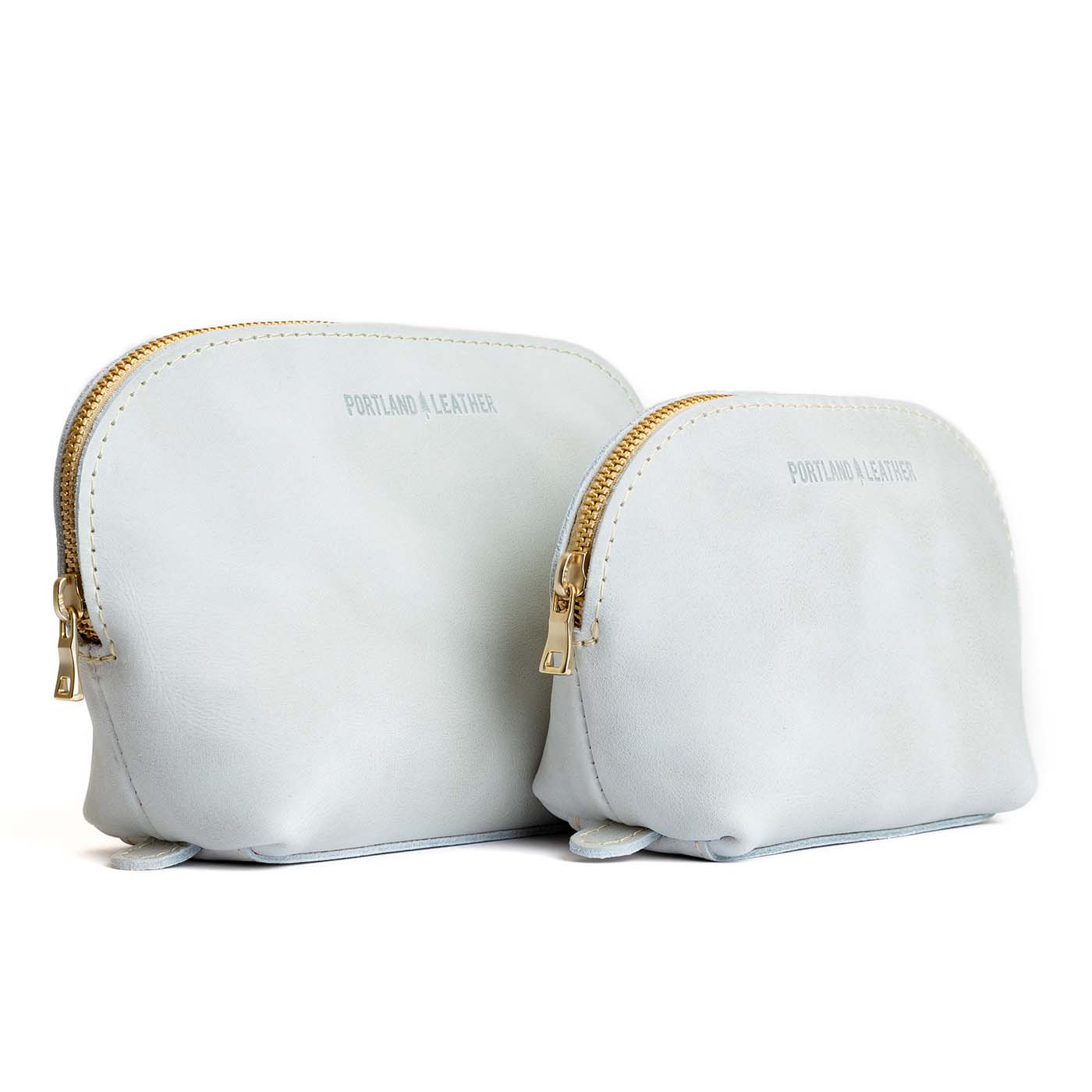 Beluga | Leather makeup bag with curved top zipper and flat bottom