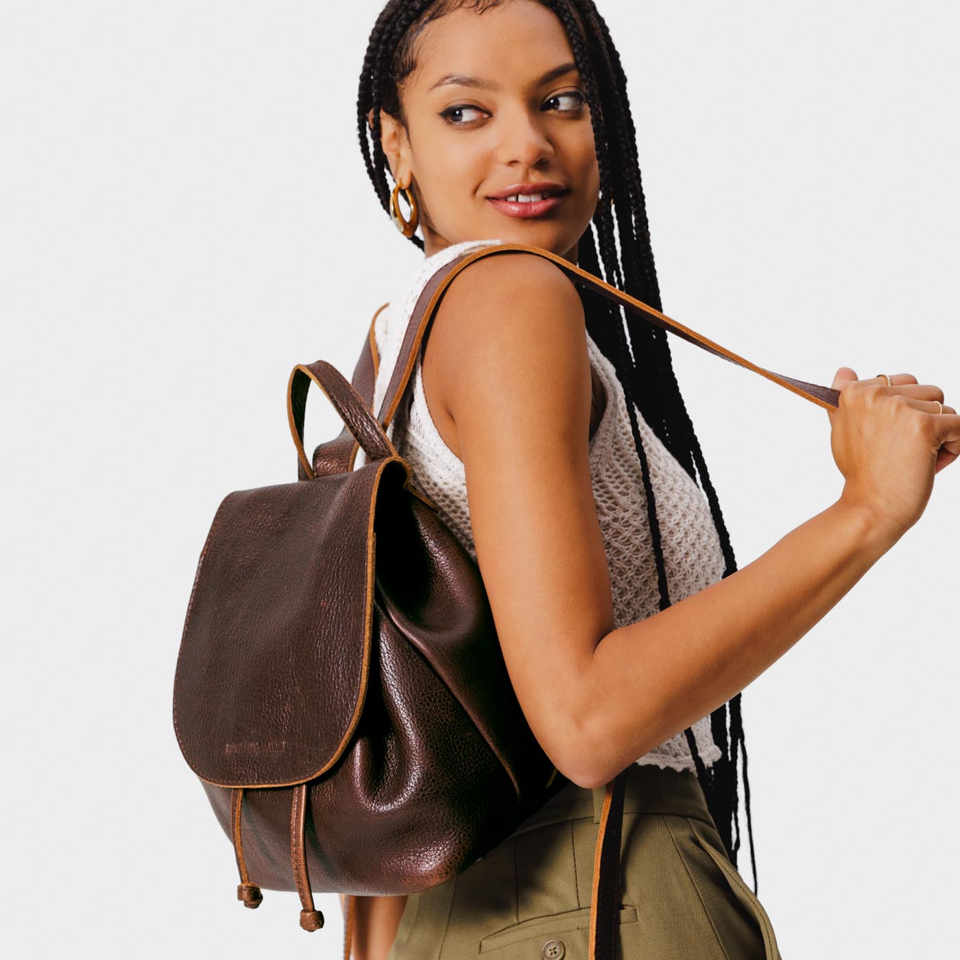 All Color: Coldbrew | Model wearing slouchy leather bucket backpack