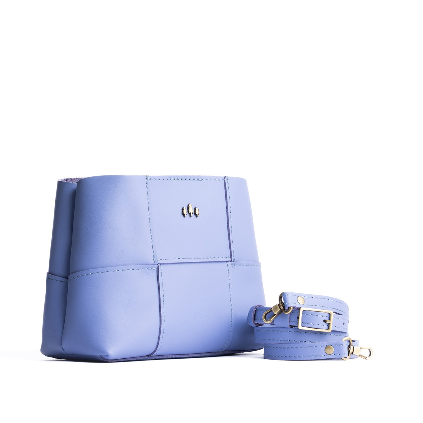 Jacaranda*Small | Structured woven leather bag with three metal tree emblems and crossbody strap