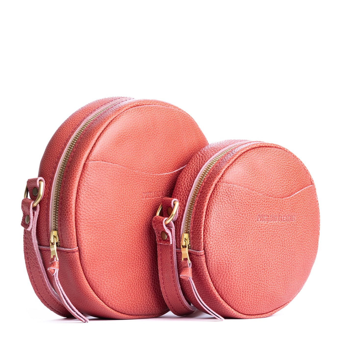 Watermelon | Side by side of two sizes of circle shaped crossbody bag with top zipper