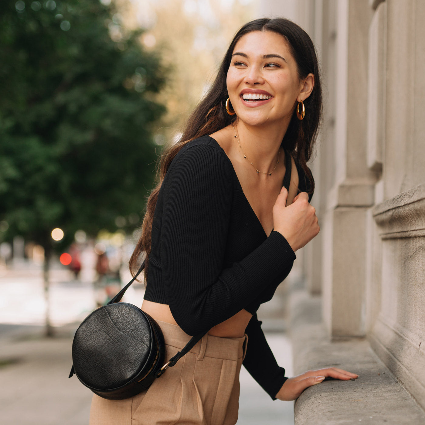 Pebbled--black*Small | Circle shaped crossbody bag with top zipper