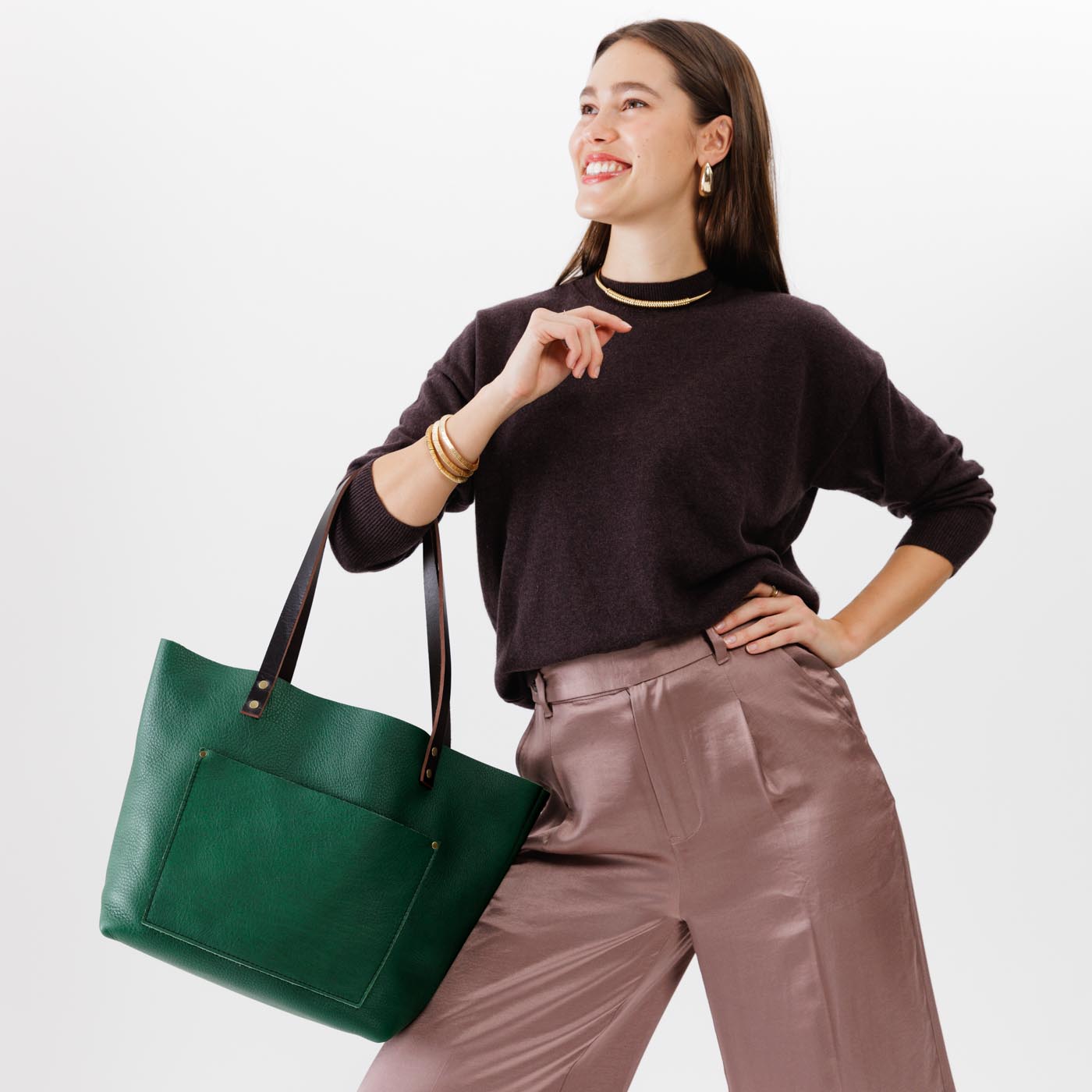 Bacalar Classic  | Model holding large leather tote bag with sturdy bridle handles and front pocket