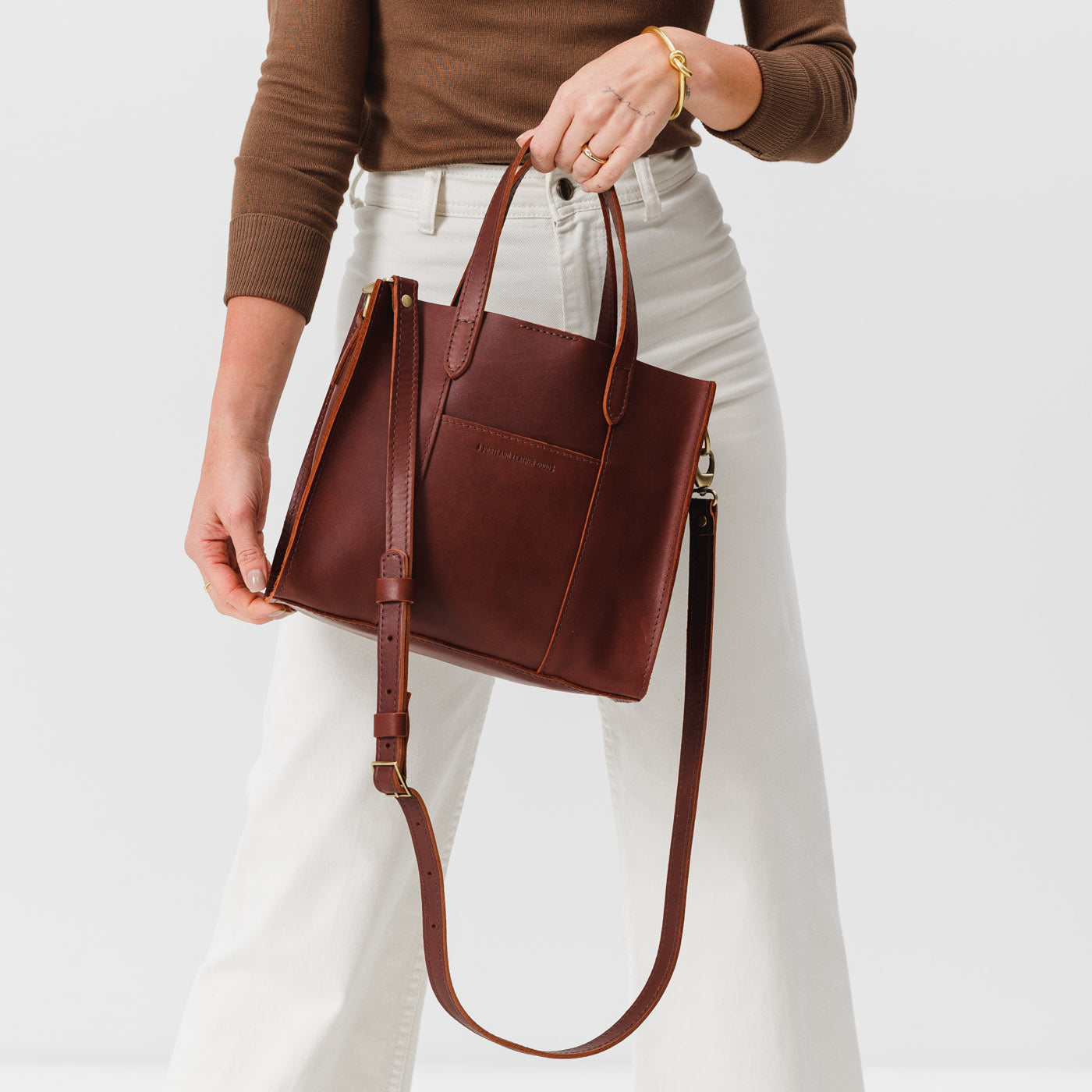 Cognac | Structured mid-size tote bag with overlapping panels and crossbody strap