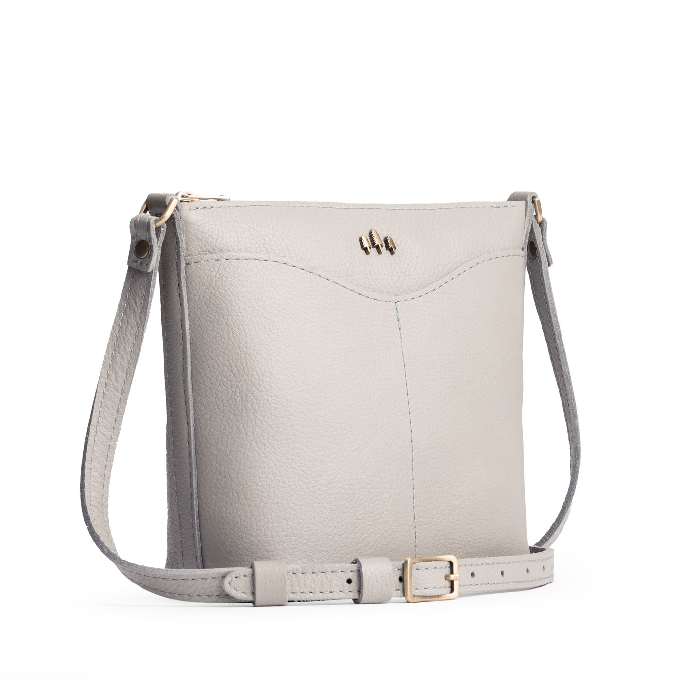 Nimbus | Rectangular side bag with curved front pocket and metal tree shaped badge