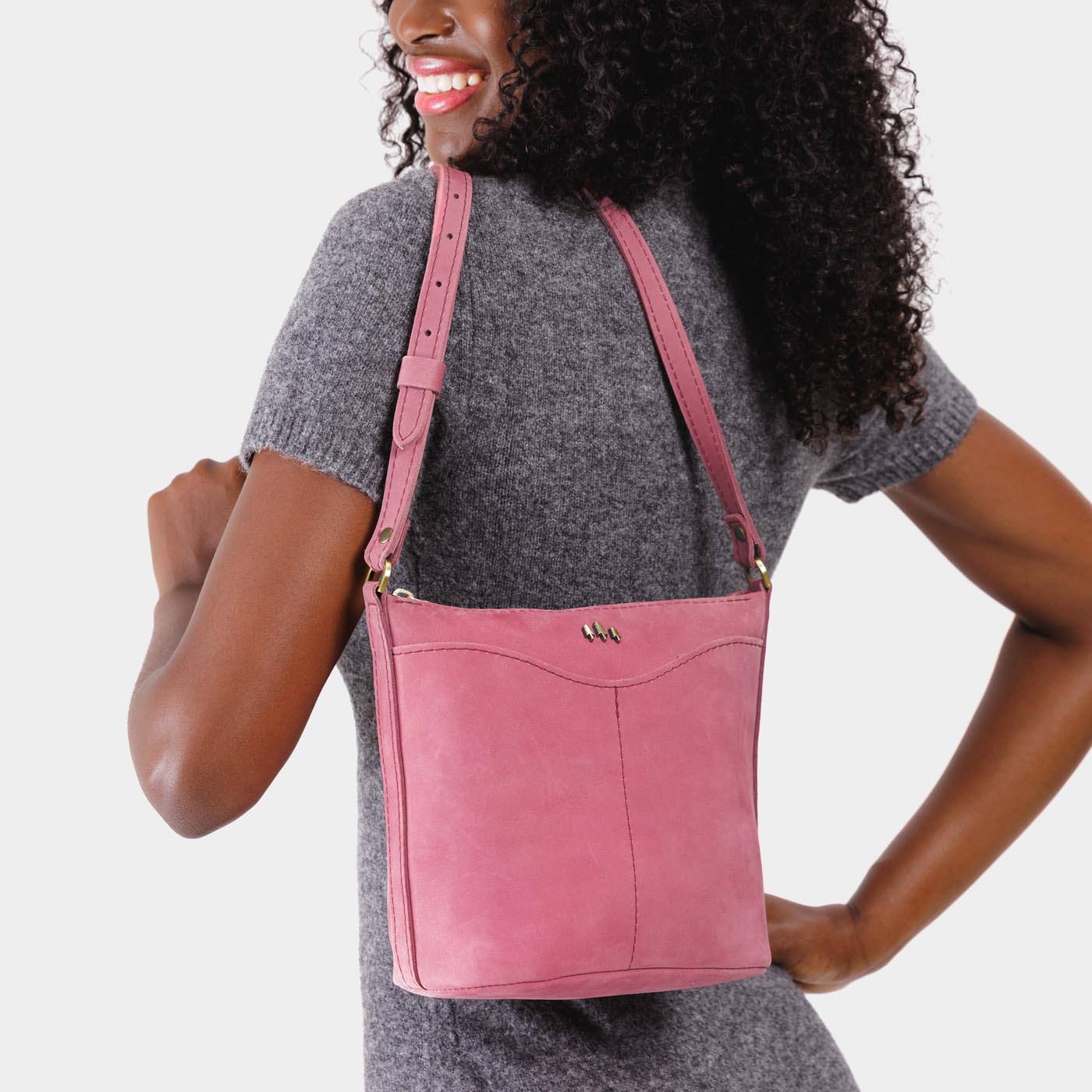 Foxglove | Model wearing rectangular side bag with curved front pocket and metal tree shaped badge