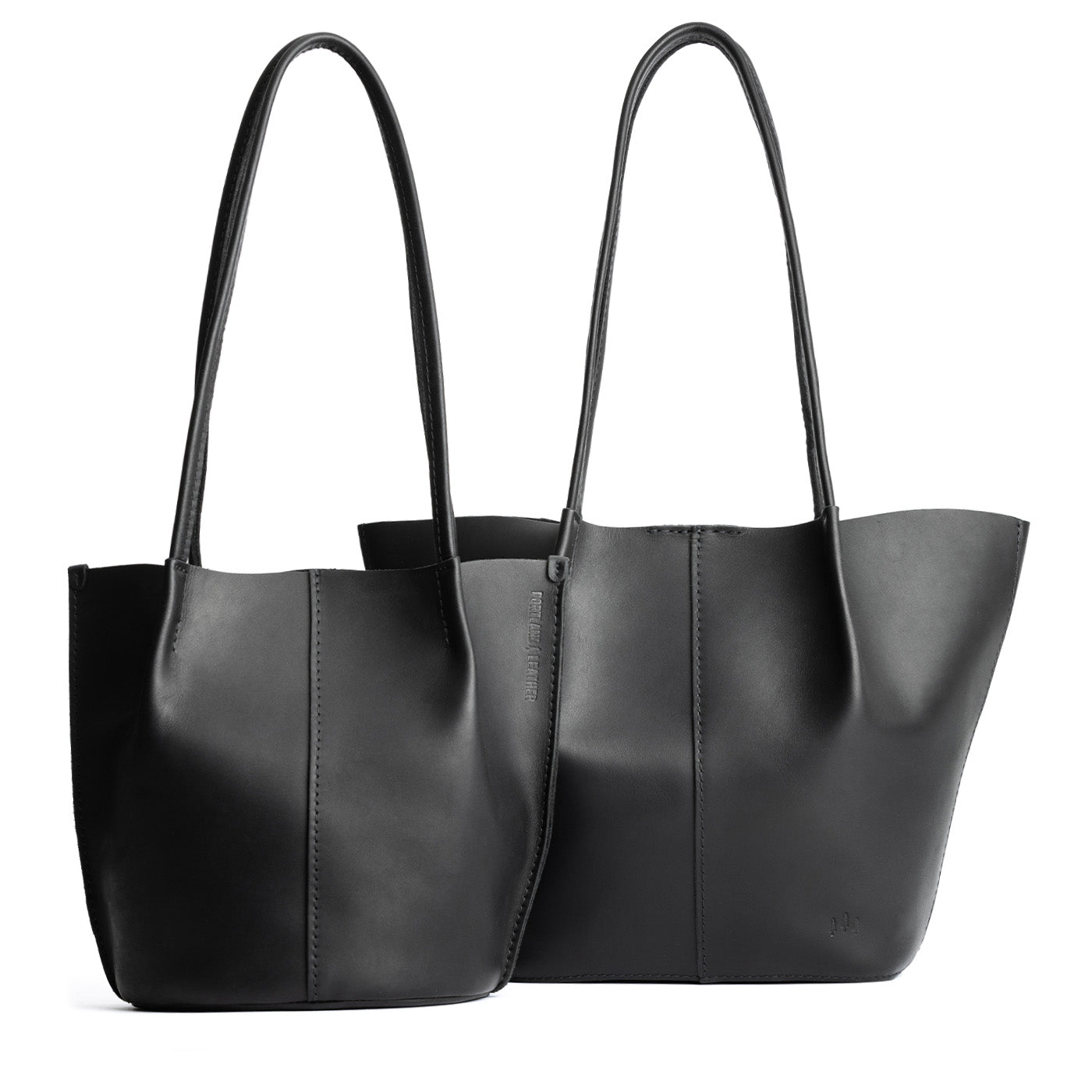 Black | Size comparison of classic and large bucket shaped tote bags with matching leather handles