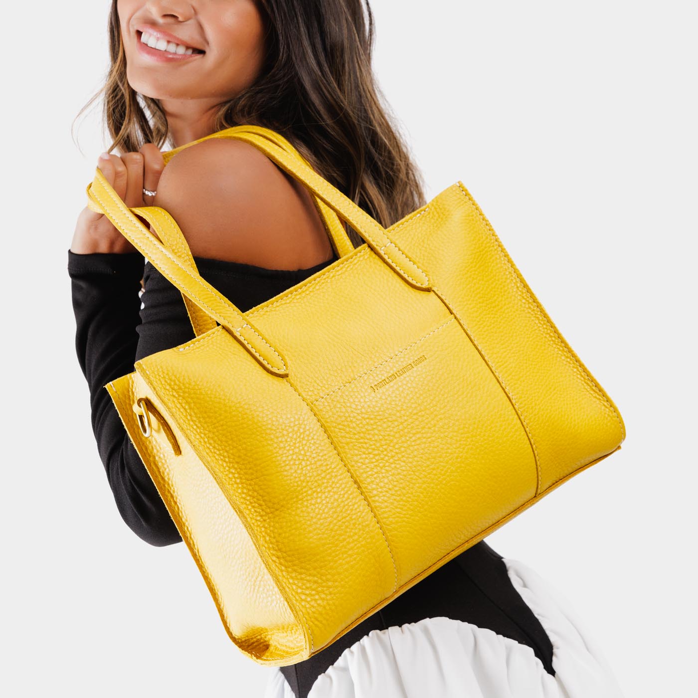 Naples*East/West | Structured wide tote bag with overlapping panels and crossbody strap