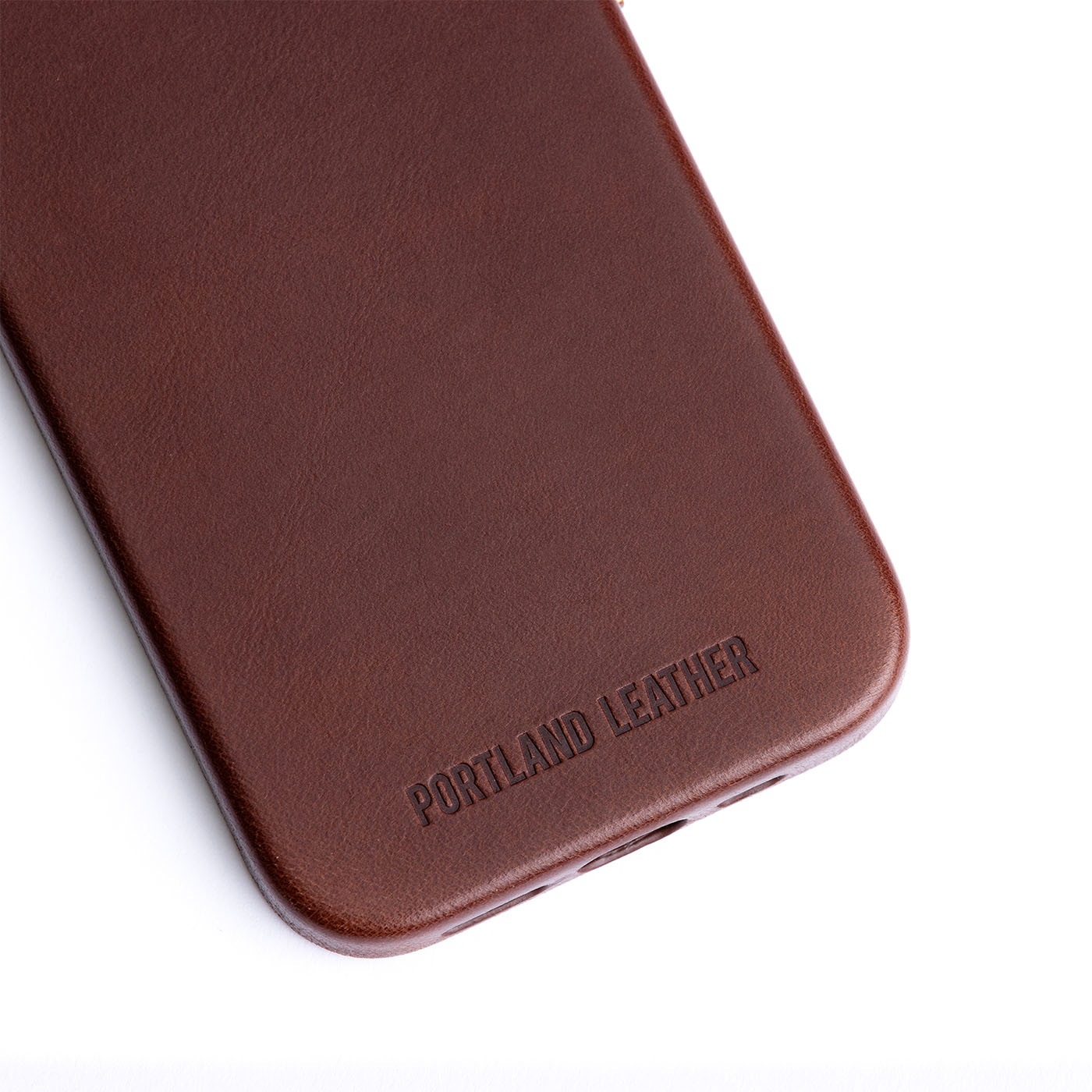 Clove  | Close up exterior IPhone case with signature Portland Leather logo