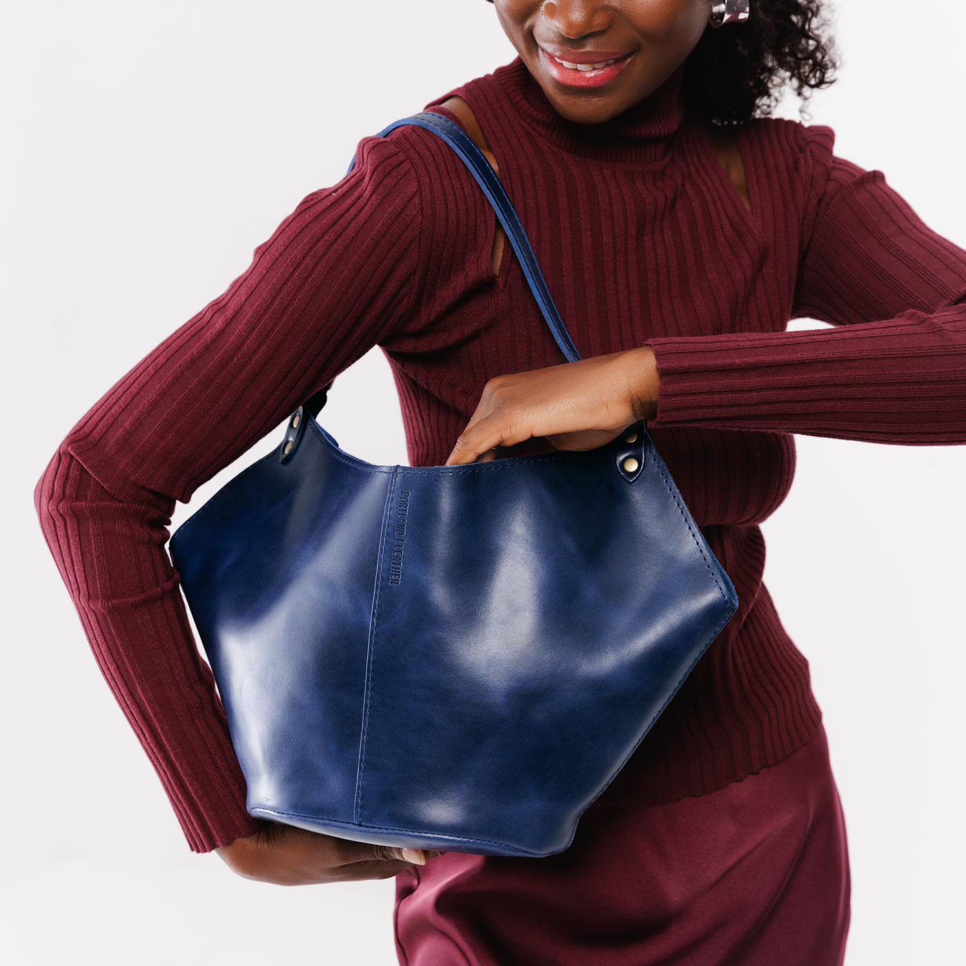 Cowboy Blue*Large | Structured bucket shaped handbag with an adjustable shoulder strap