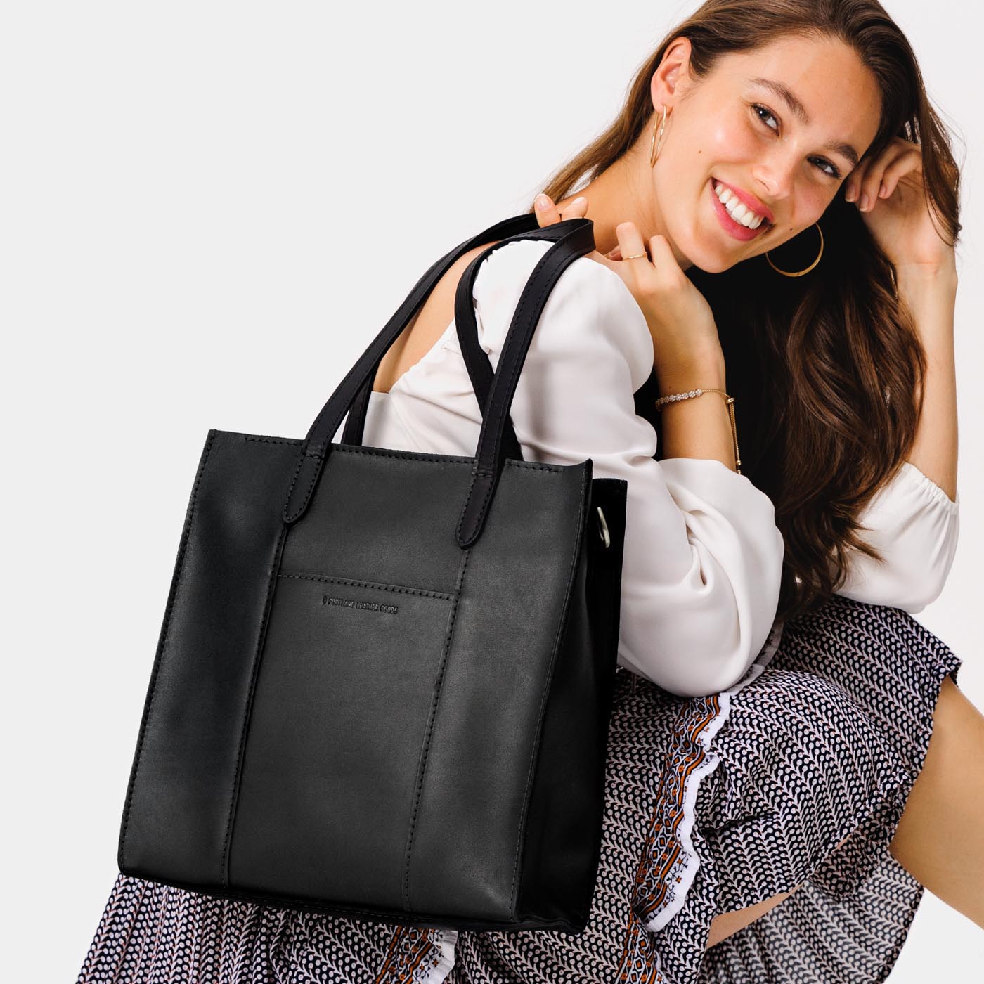  Black North/South | Structured large tote bag with overlapping panels and crossbody strap