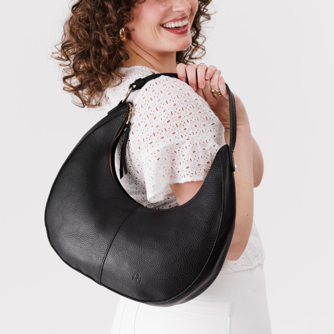 Pebbled--black*Large  | Large crescent shaped shoulder bag with zipper closure and adjustable strap