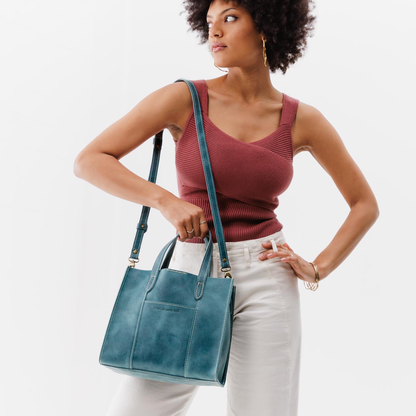 Aqua | Structured mid-size tote bag with overlapping panels and crossbody strap