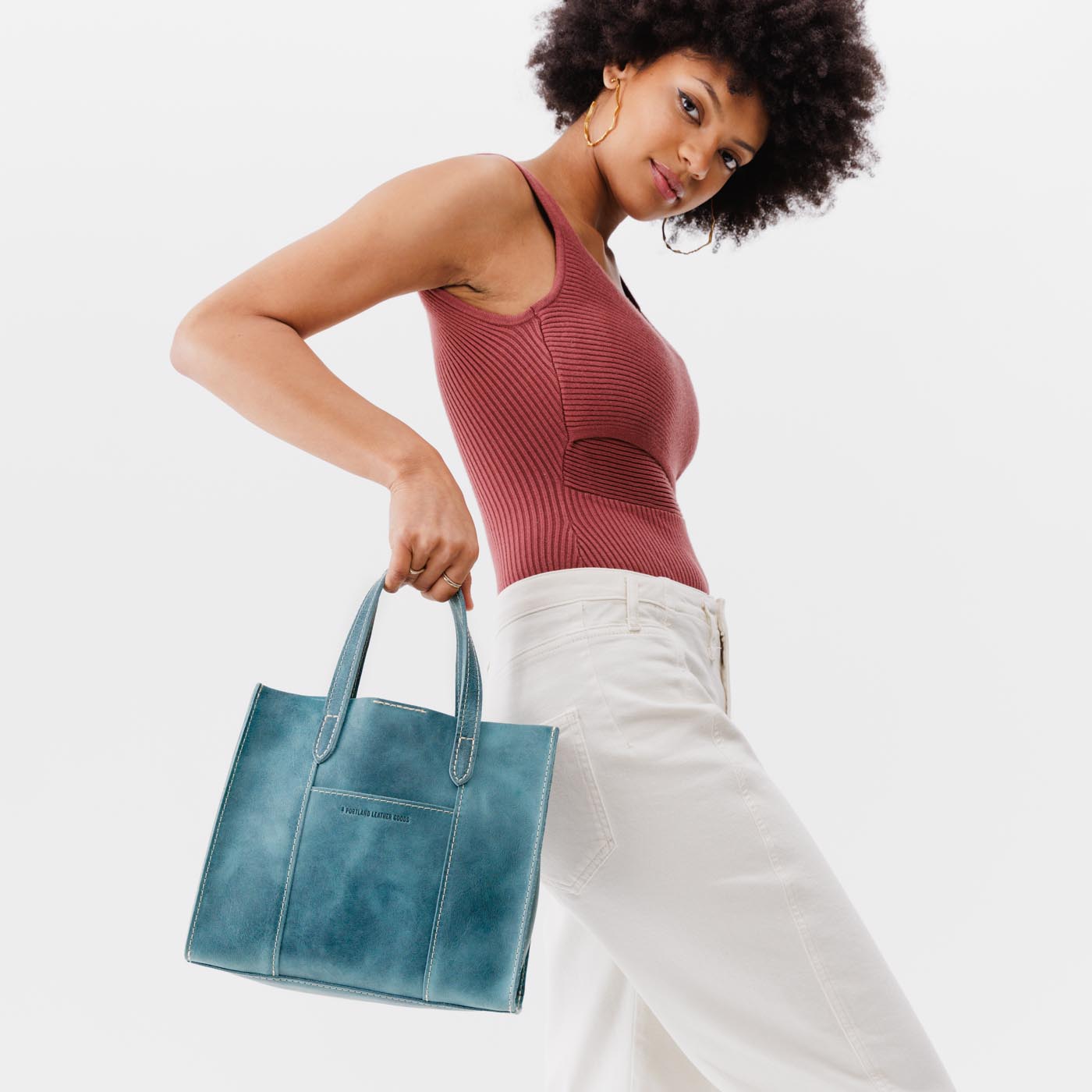 Aqua | Structured mid-size tote bag with overlapping panels and crossbody strap