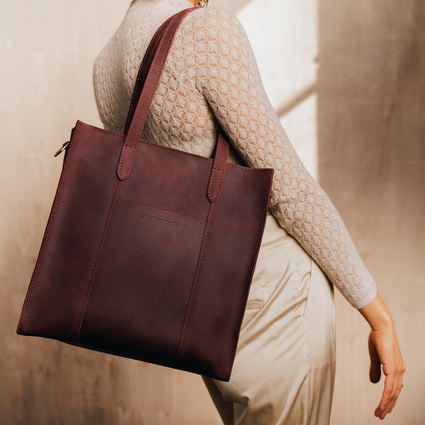 Merlot*North/South | Structured large tote bag with overlapping panels and crossbody strap