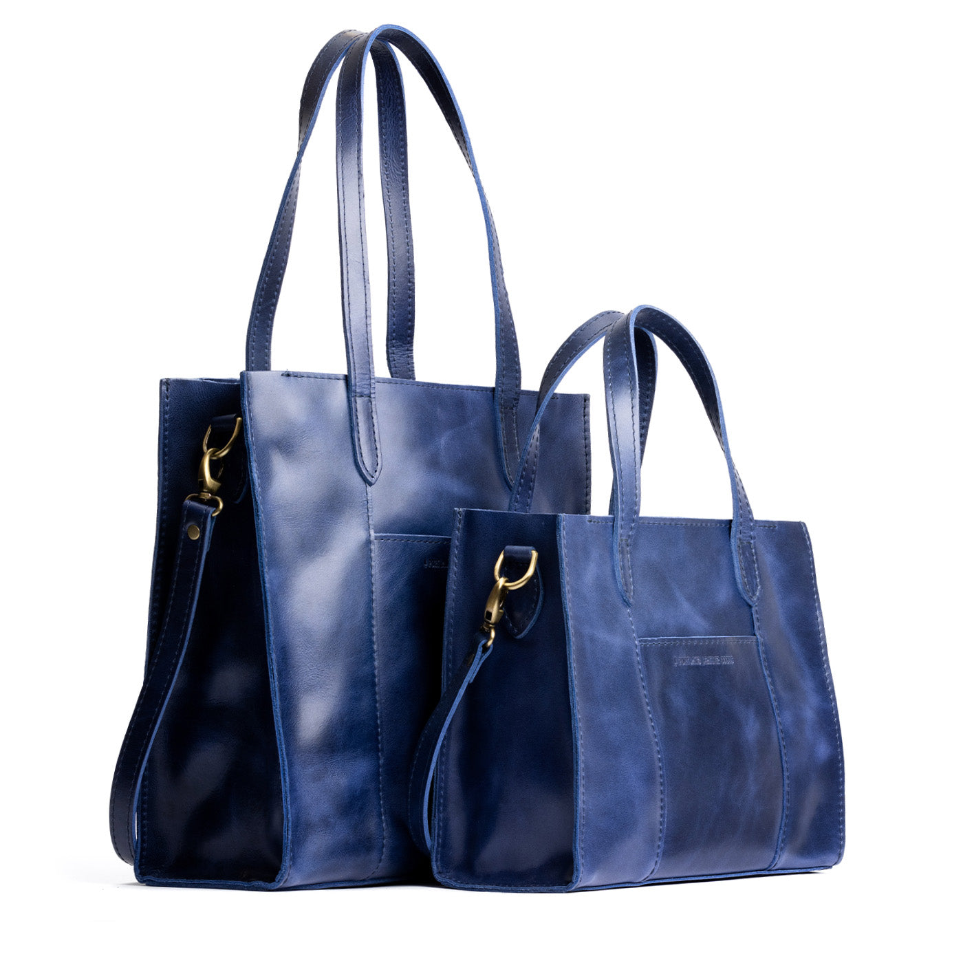 Cowboy Blue | Structured mid-size tote bag with overlapping panels and crossbody strap