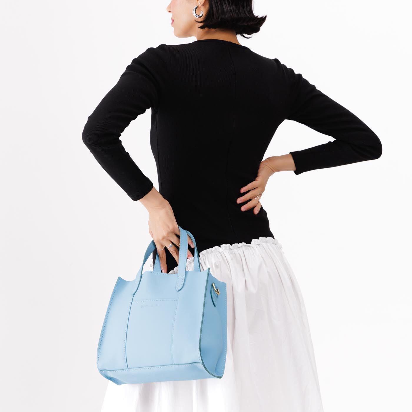 Glacial Blue | Structured mid-size tote bag with overlapping panels and crossbody strap