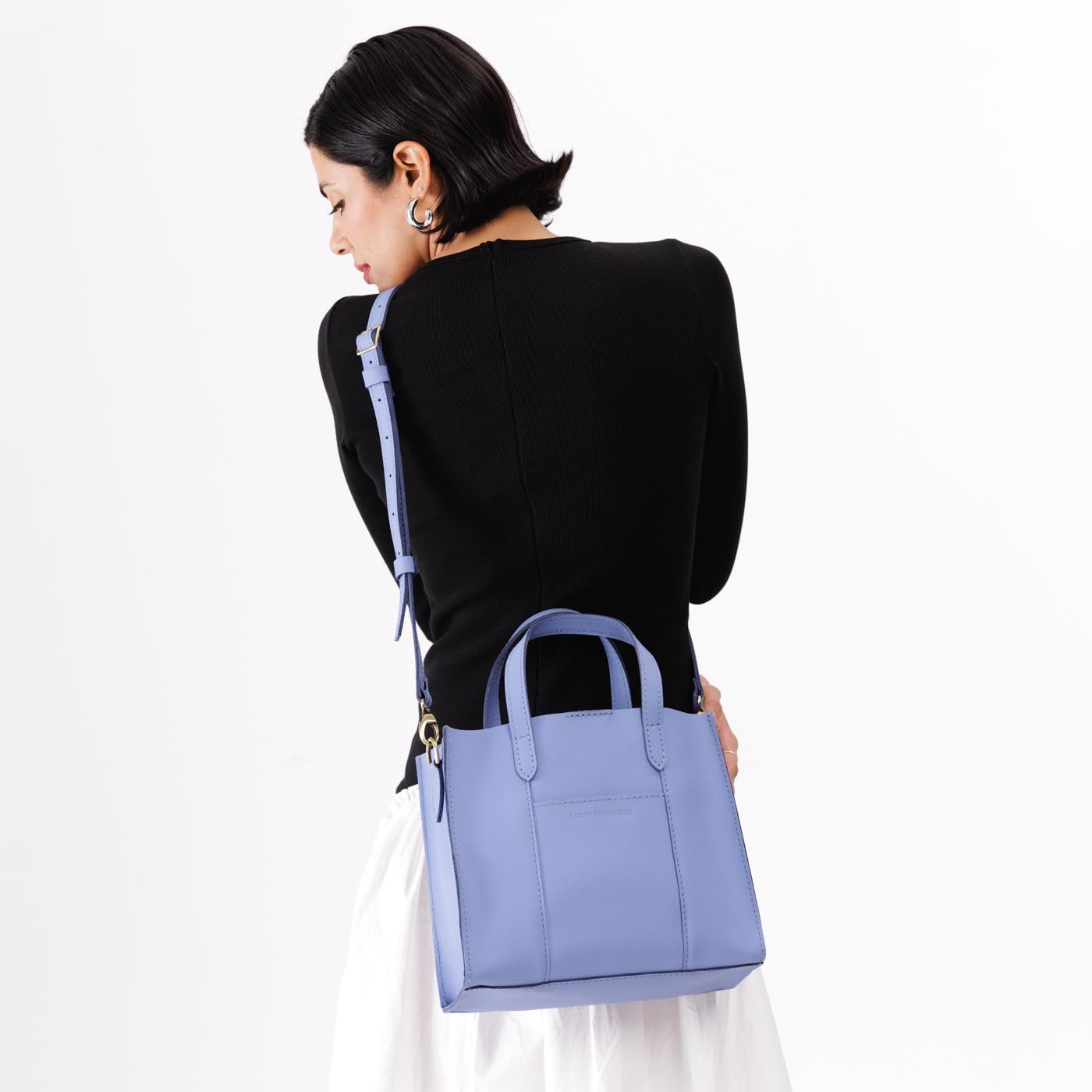 Jacaranda | Structured mid-size tote bag with overlapping panels and crossbody strap