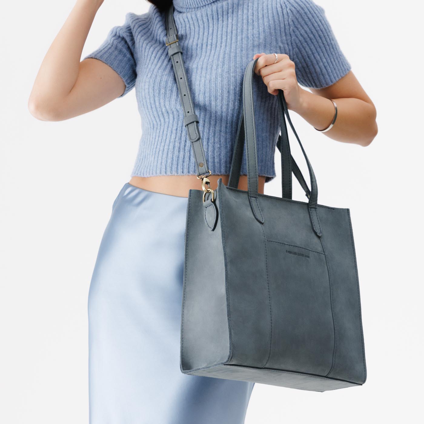 Storm*North/South | Structured large tote bag with overlapping panels and crossbody strap