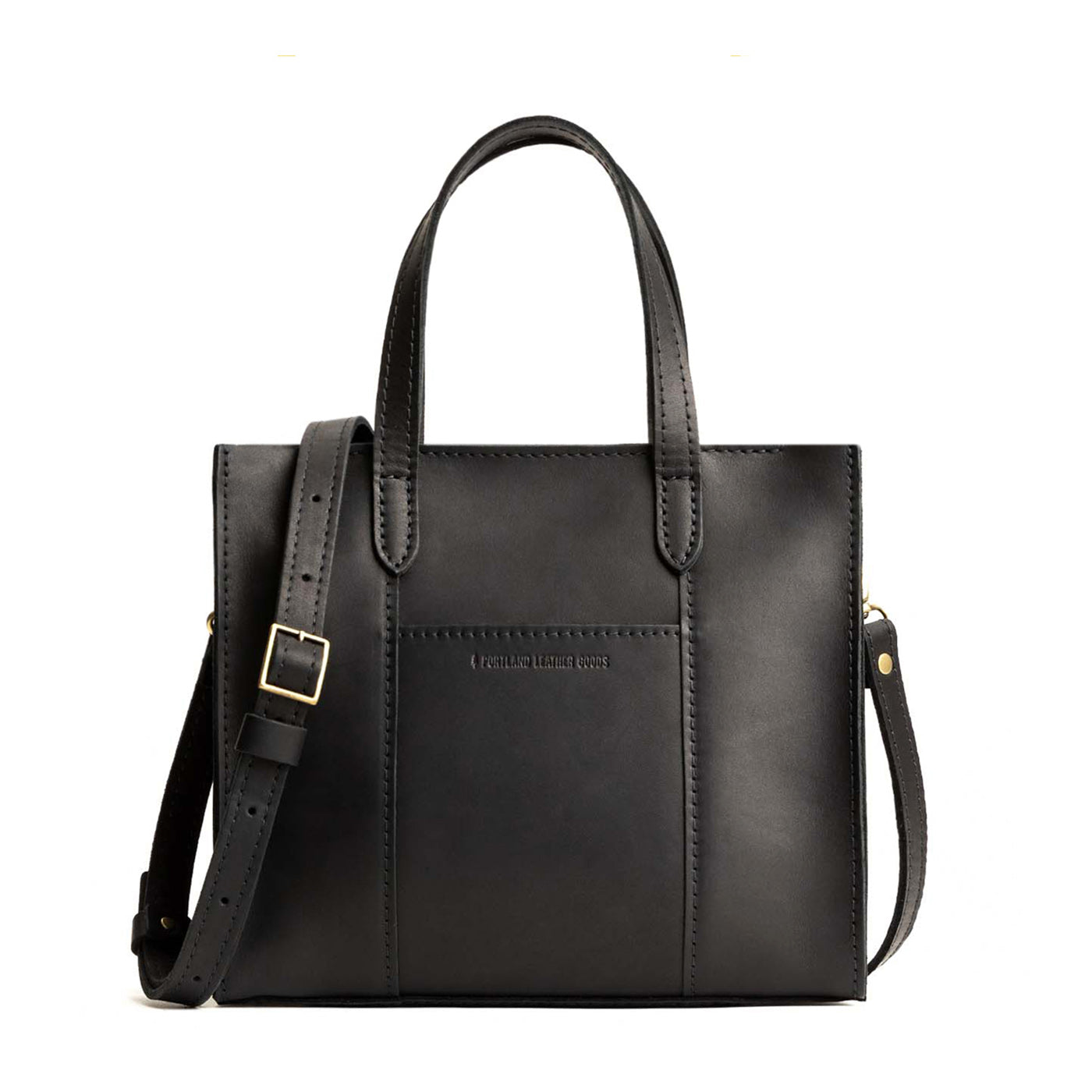 Black*Zipper | Structured mid-size tote bag with overlapping panels and crossbody strap