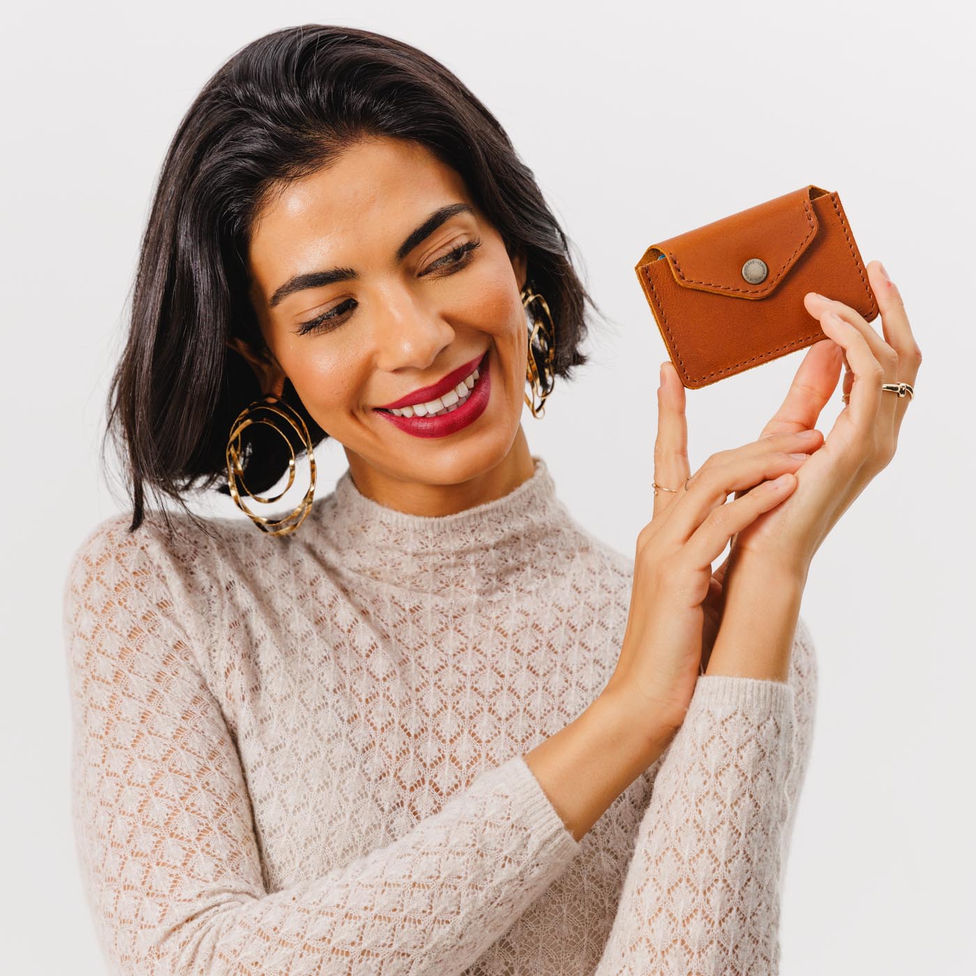 Honey | Model holding small leather wallet with snap closure