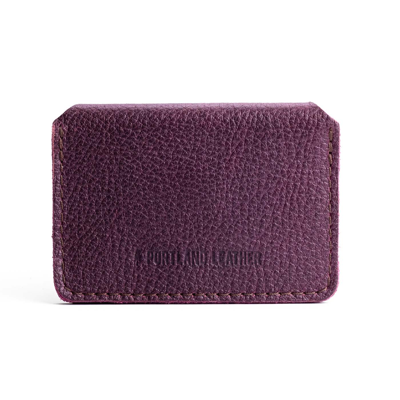 Plum | Backside of small leather wallet with debossed PLG logo