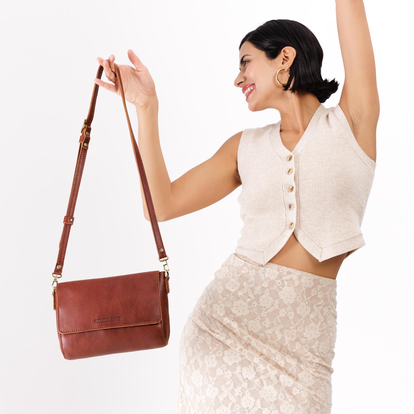 Nutmeg Medium | Model wearing leather Crossbody Bag with Magnetic Messenger Bag Closure