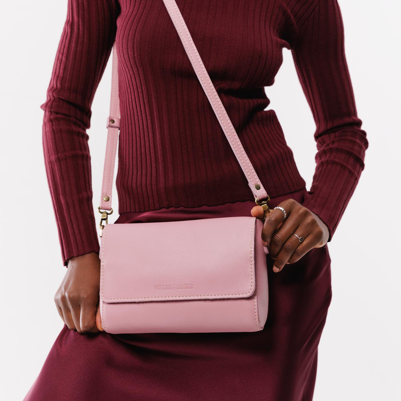 Vintage Pink Medium | Model Wearing Leather Crossbody Bag with Magnetic Messenger Bag Closure