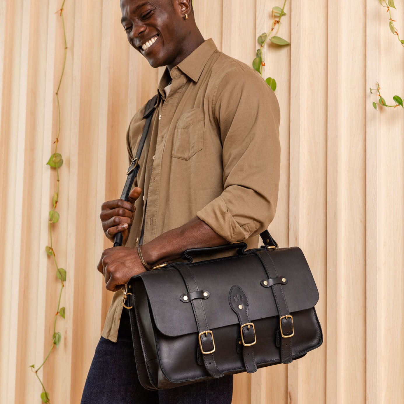  Black | Traditional messenger bag with multi buckle closure and crossbody strap