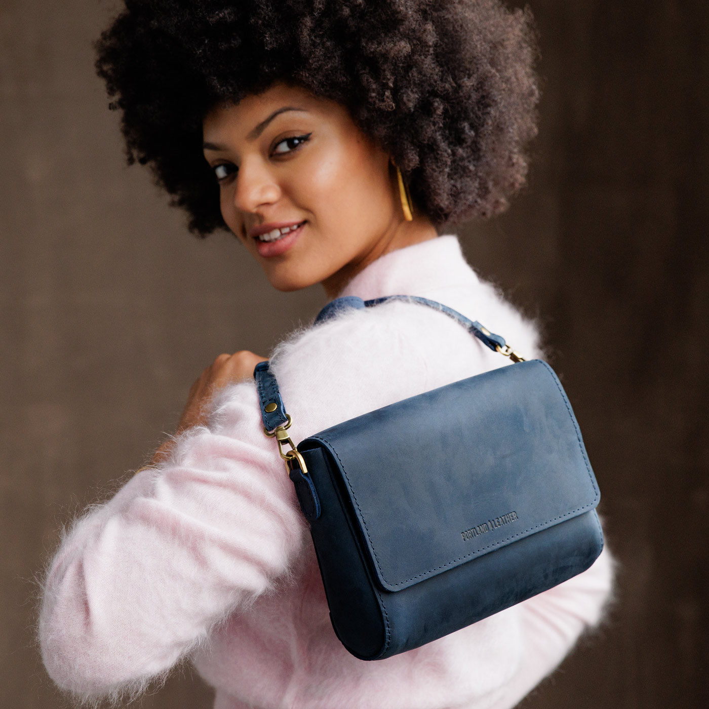 Deep Water*Medium | Model Holding Leather Crossbody Bag with Magnetic Messenger Bag Closure