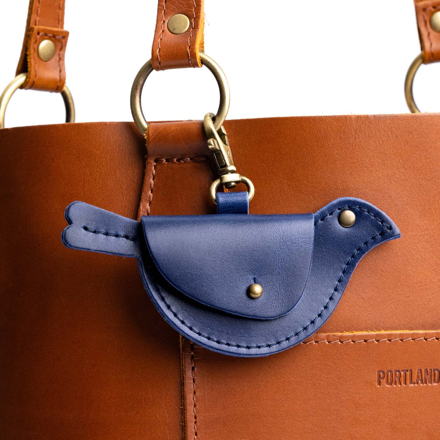 Cowboy Blue | Bird shaped pouch with button closure and lobster clasp