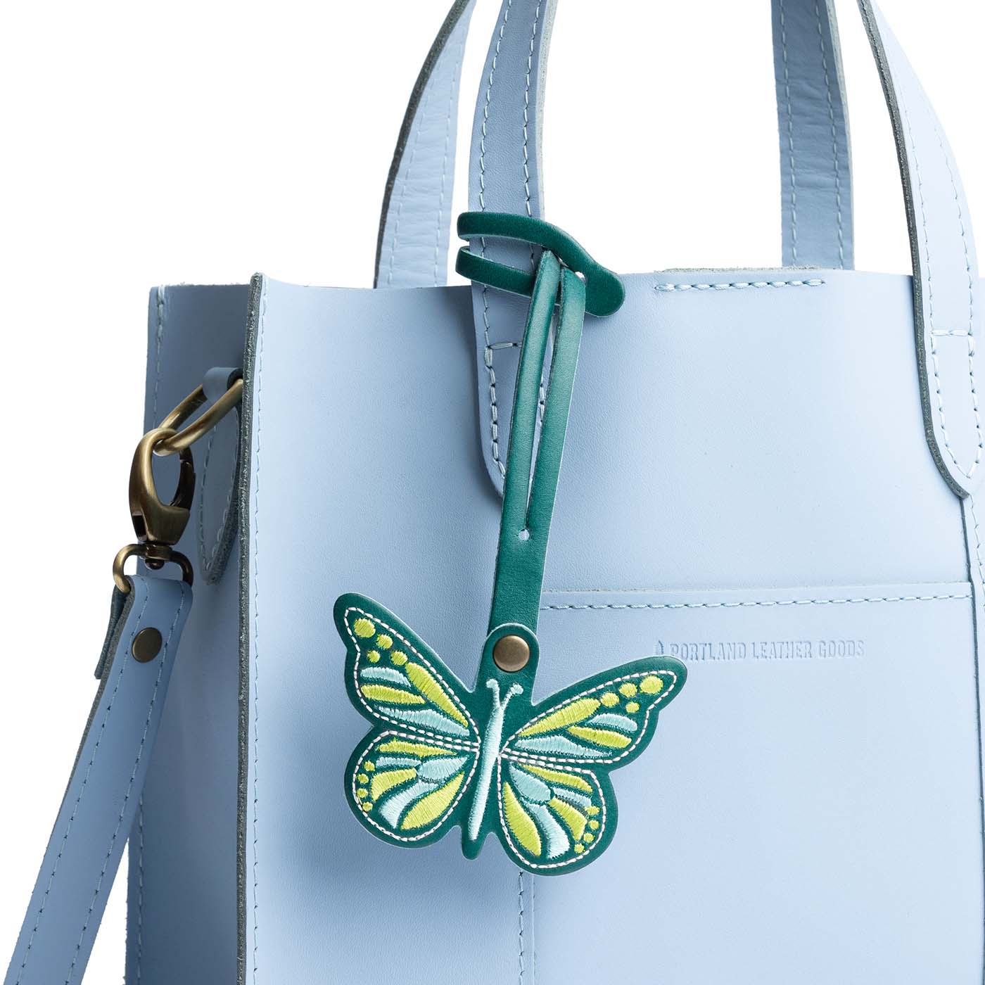 Caribbean | Embroidered butterfly tassel accessory on a bag