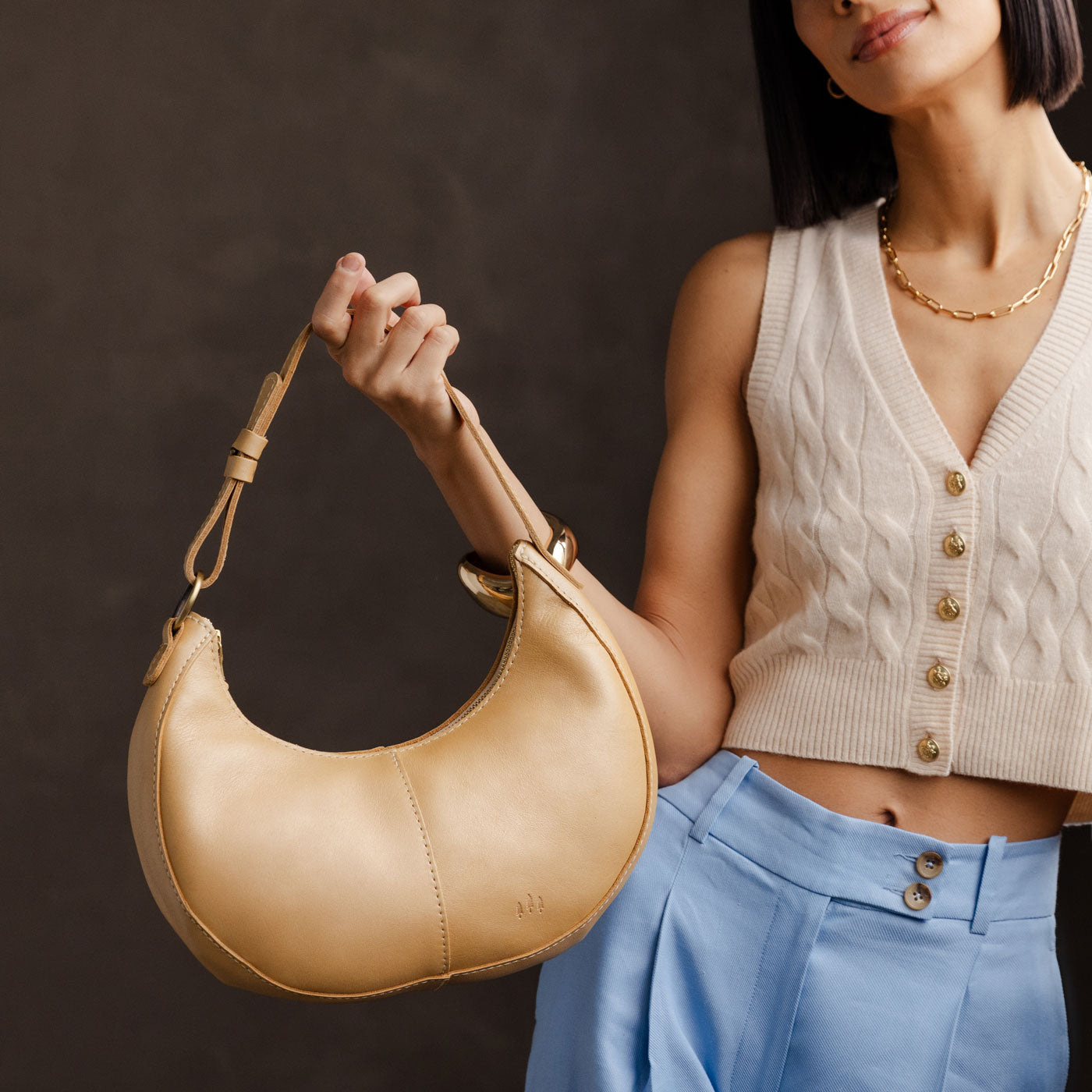 Champagne*Classic | Crescent shaped shoulder bag with zipper closure and adjustable strap