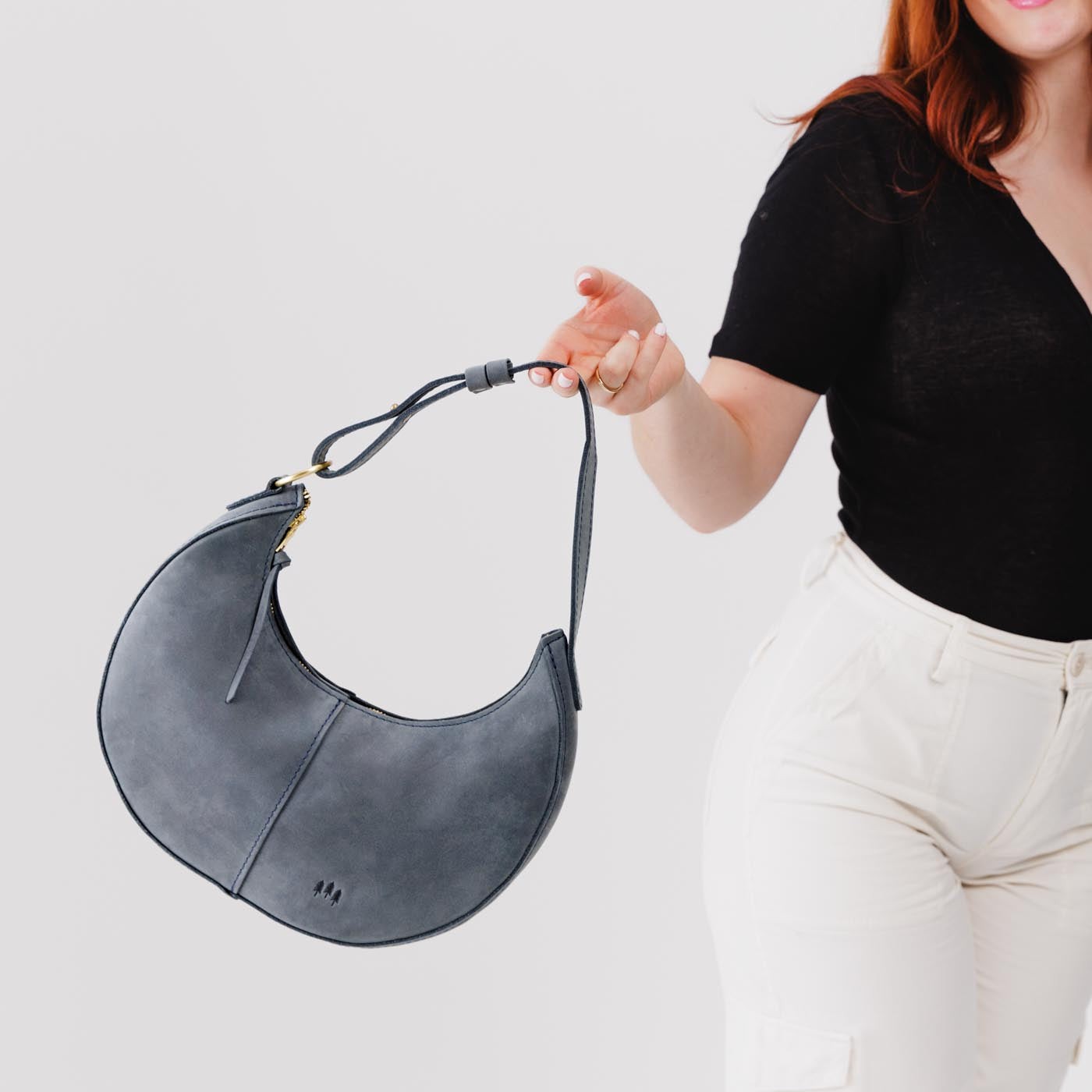 Storm*Classic | Crescent shaped shoulder bag with zipper closure and adjustable strap