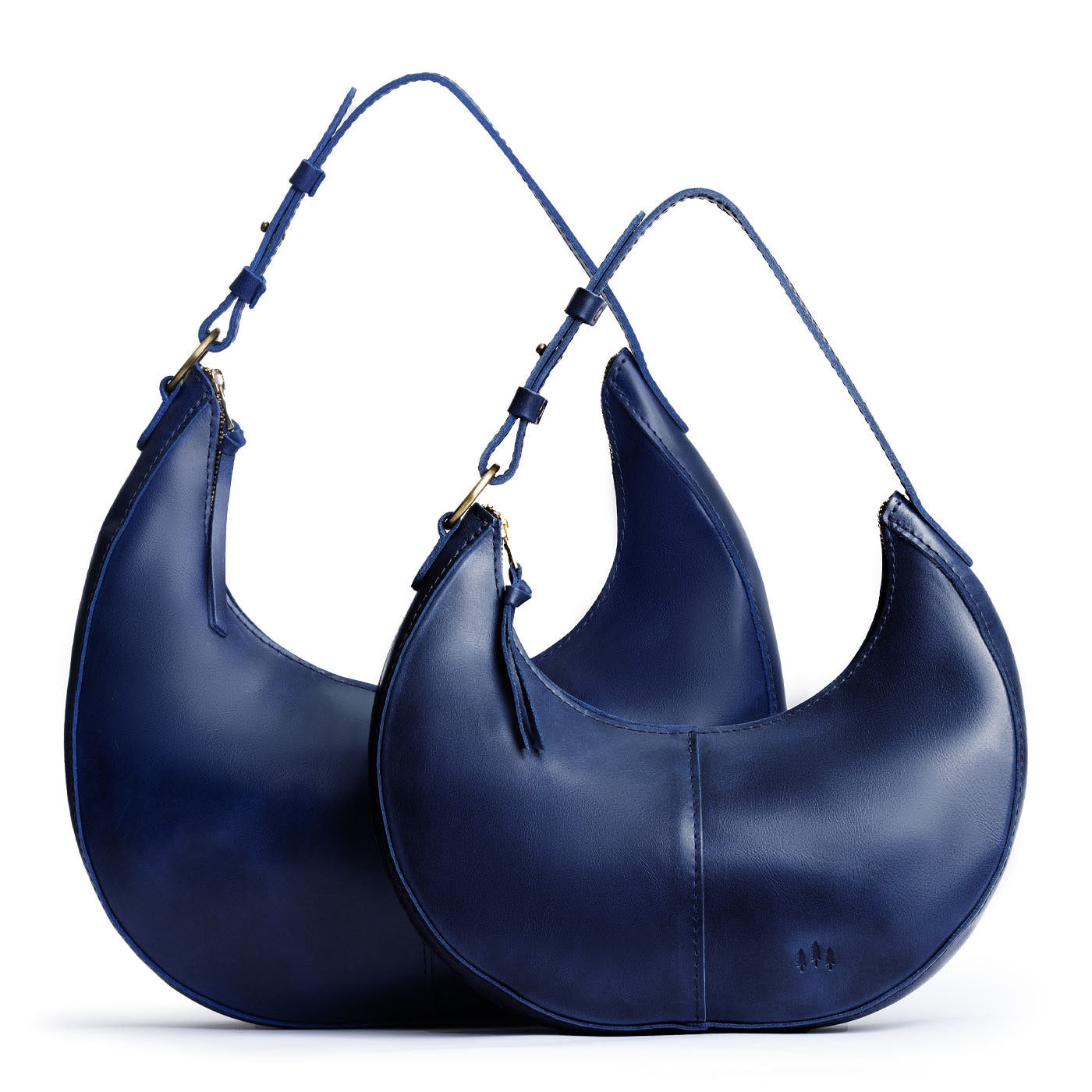 Cowboy Blue | Crescent shaped shoulder bag with zipper closure and adjustable strap