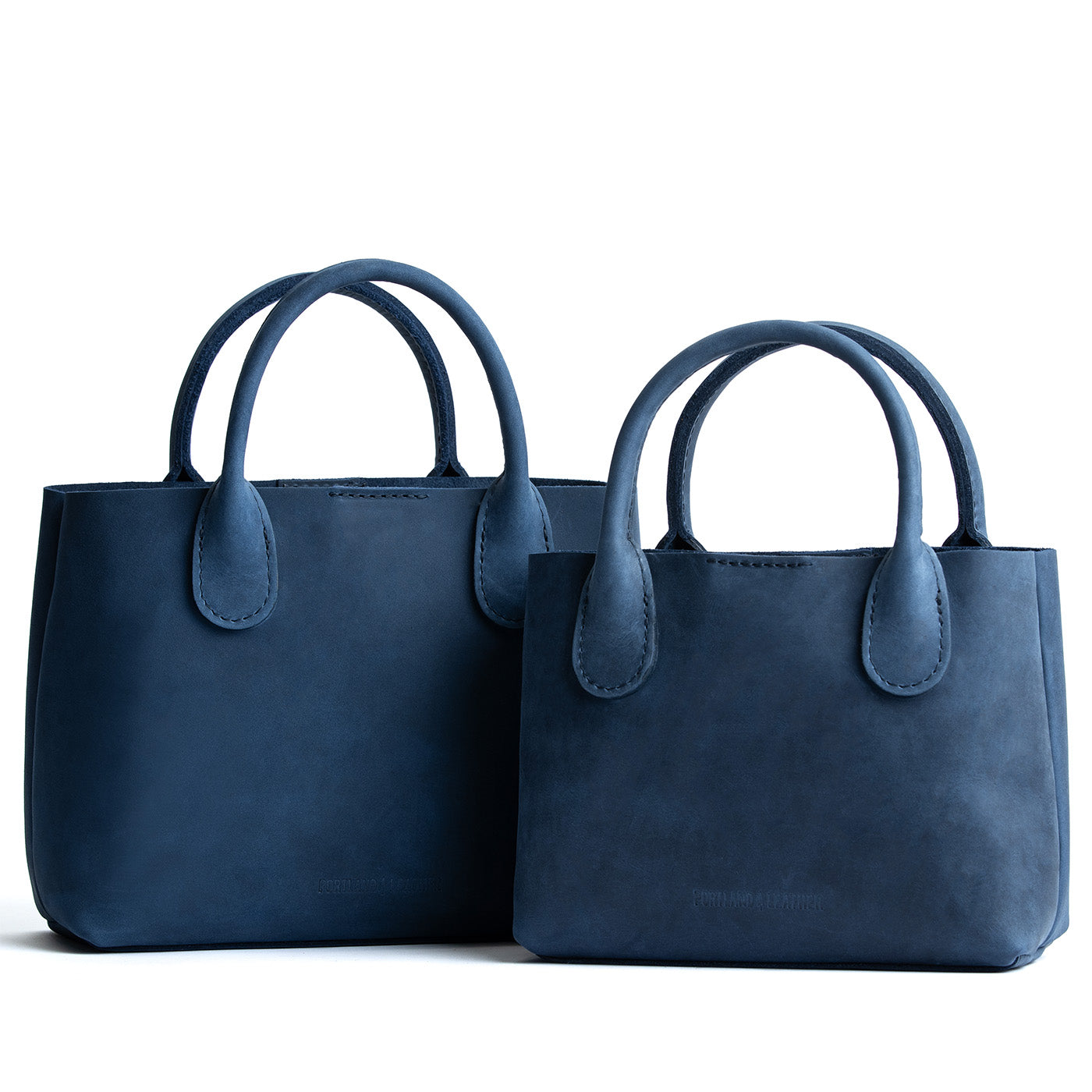 Deep Water  | Side by side of both tote purses with structured leather handles and crossbody strap