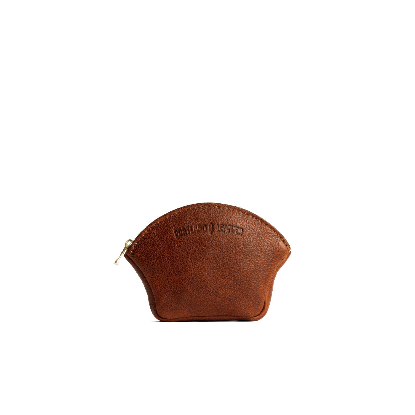 Nutmeg Small | Seashell shaped leather makeup bag with curved top zipper and flat bottom