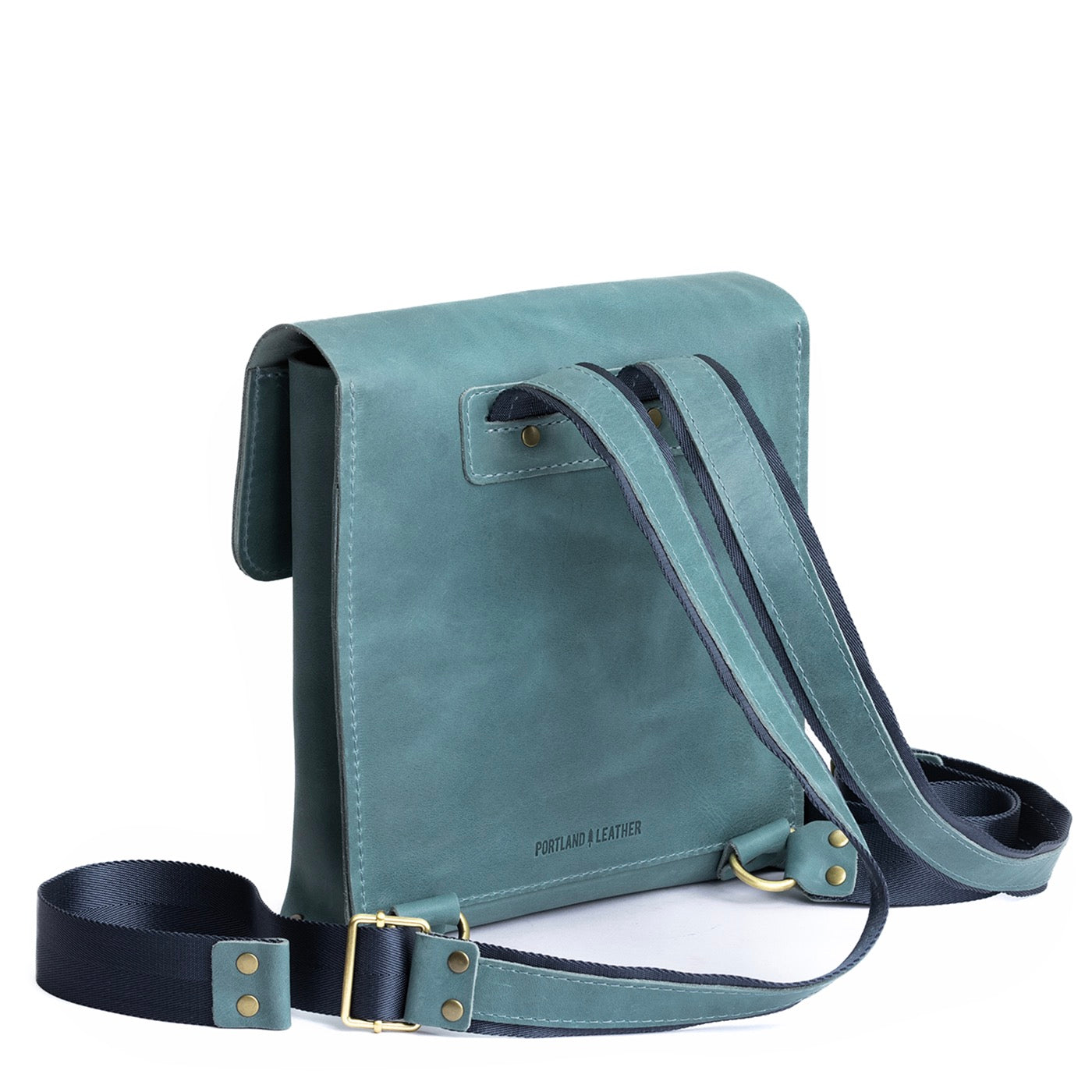 Aqua | Rectangular backpack with leather lined nylon straps and magnetic flap closure