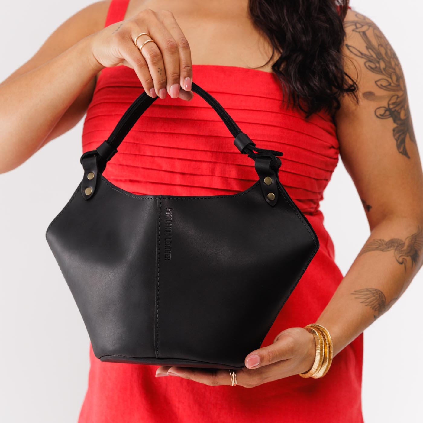 Black*Small | Structured bucket shaped handbag with an adjustable shoulder strap