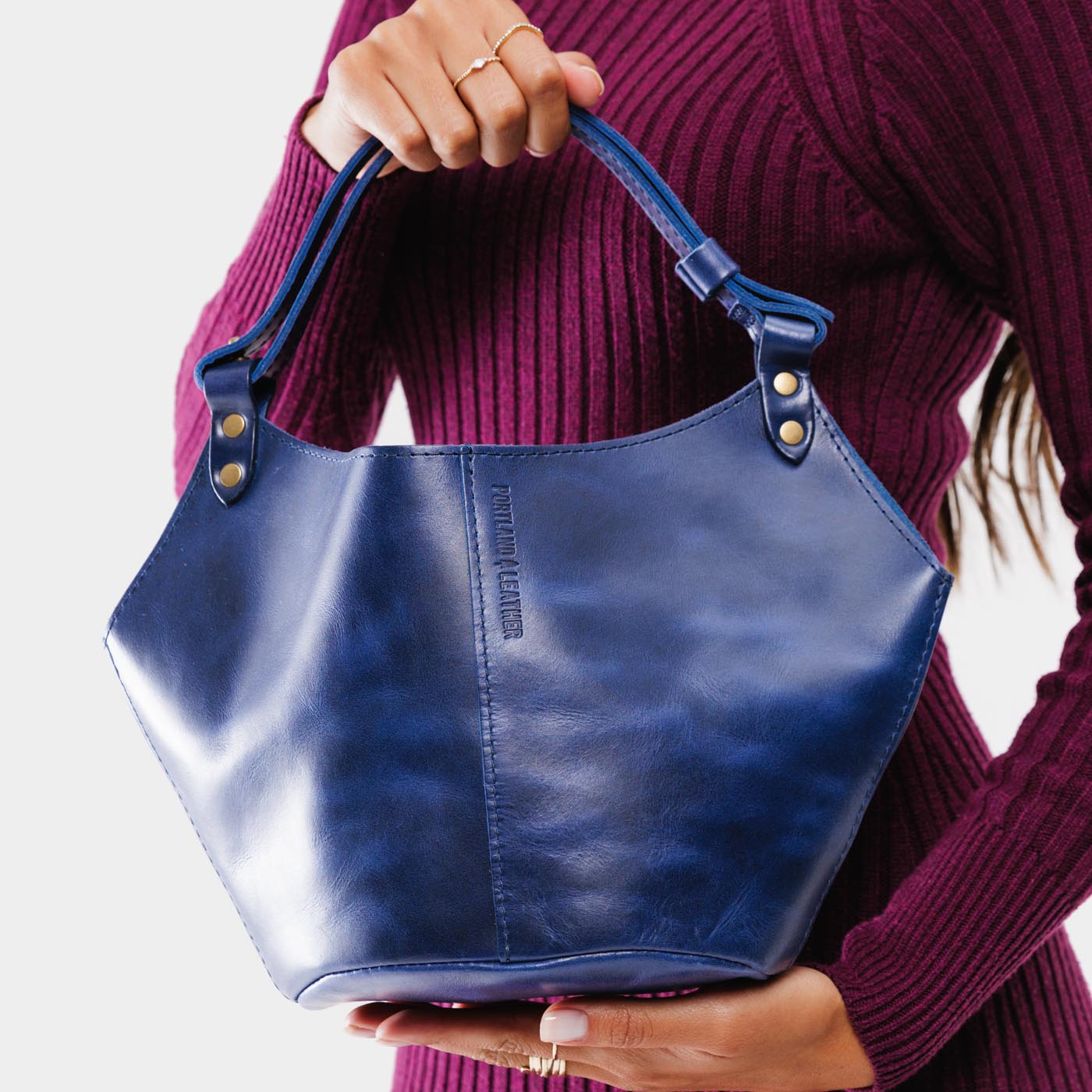 Cowboy Blue Small | Structured bucket shaped handbag with an adjustable shoulder strap