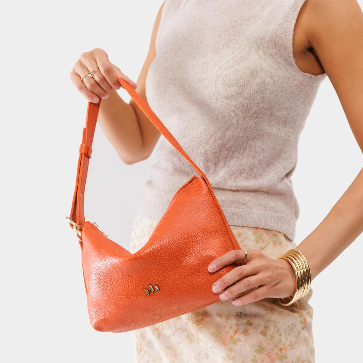 Koi Small | Petite slouchy leather shoulder bag with zipper opening and three metal tree emblems