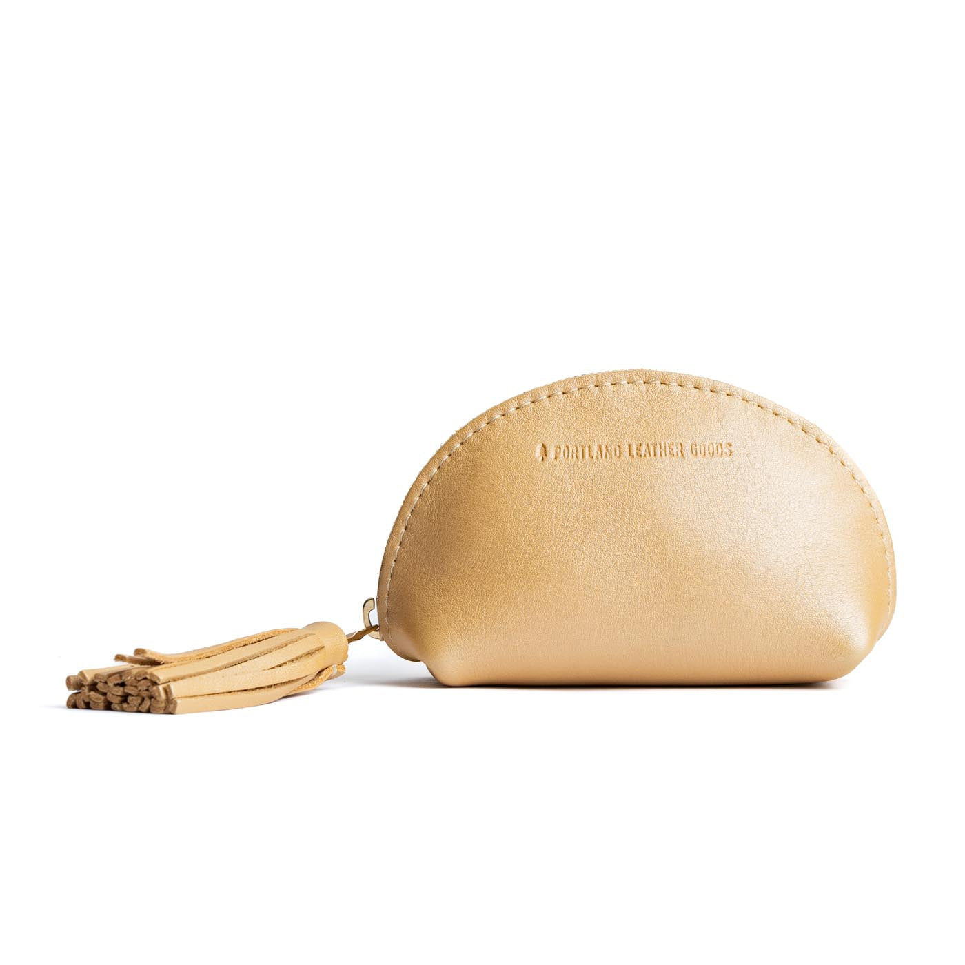 All Color: Champagne | Small leather zippered pouch with tassel