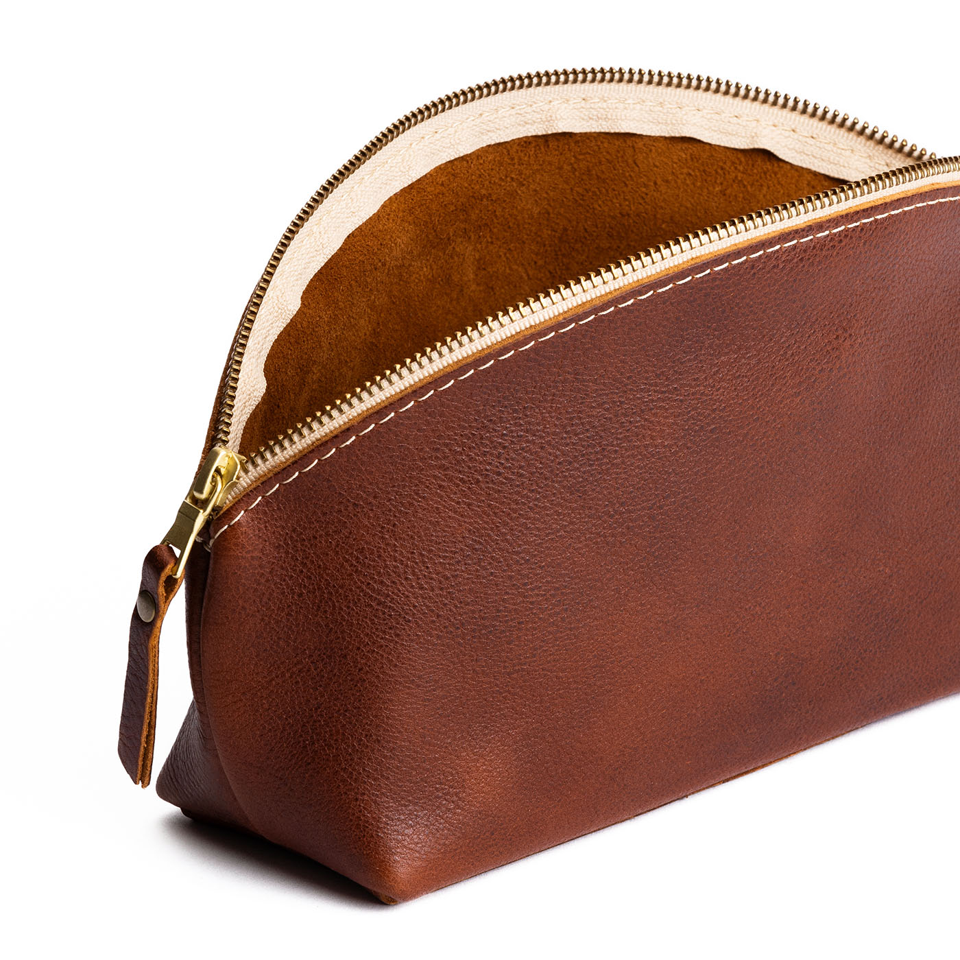 Nutmeg | Spacious leather makeup bag with curved seams and top zipper