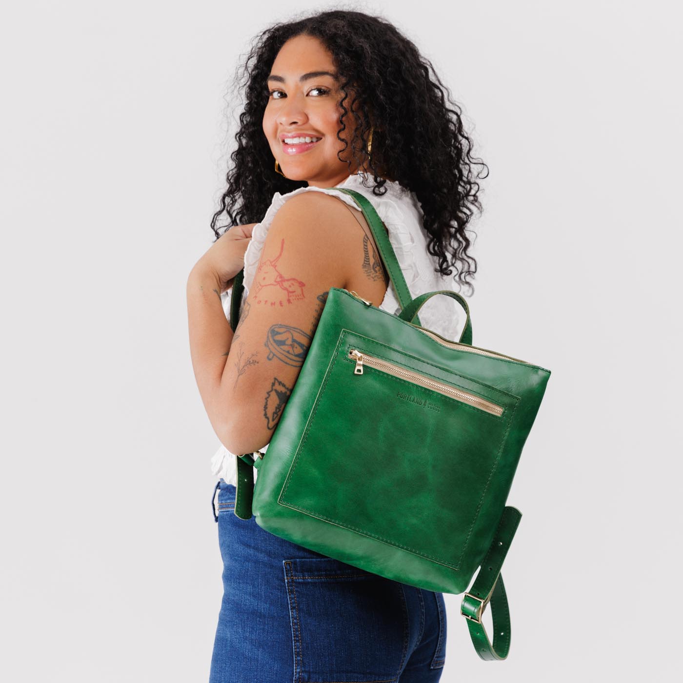 All Color: Cowboy Mint | Model wearing square slim leather tote backpack