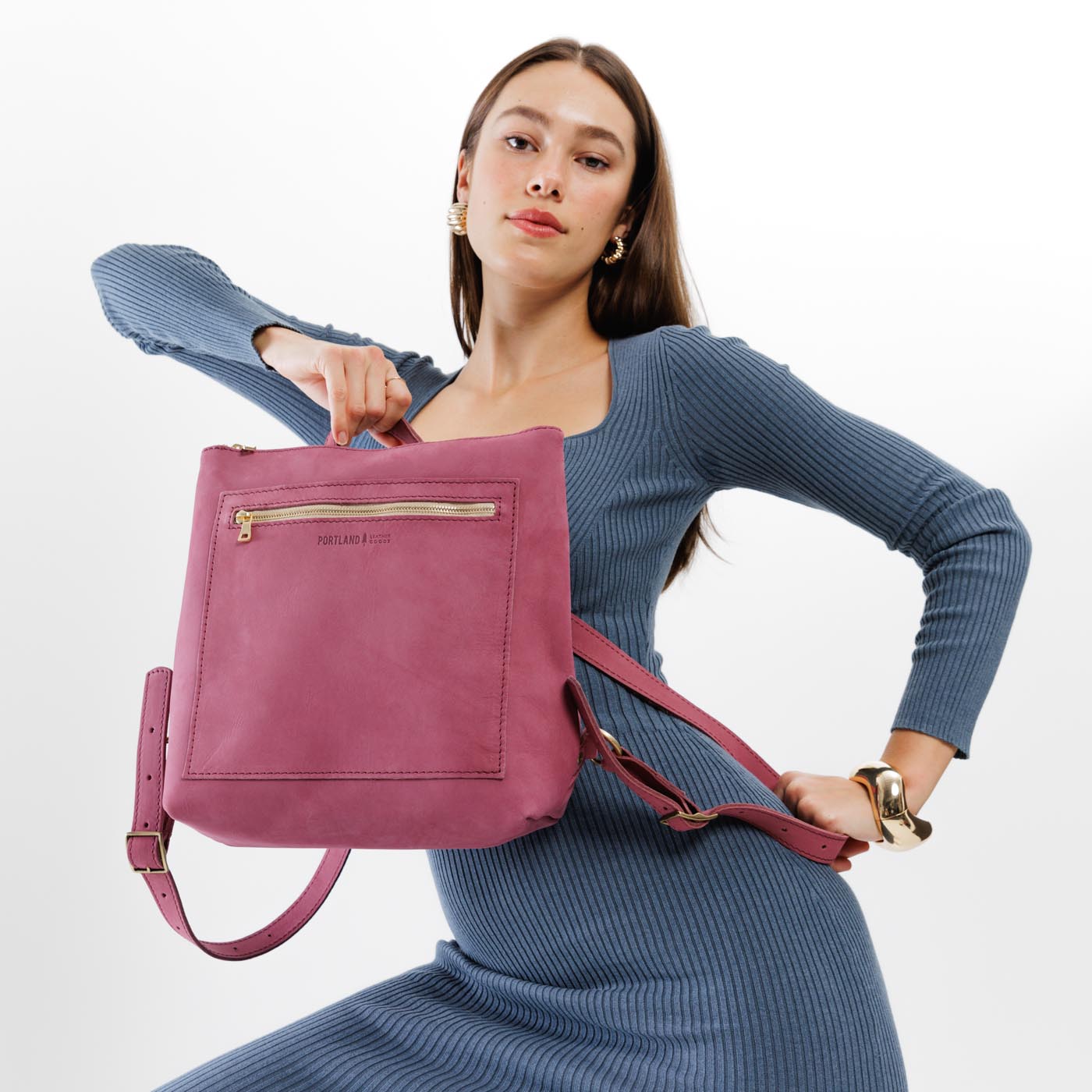 All Color: Foxglove | Model holding square slim leather tote backpack