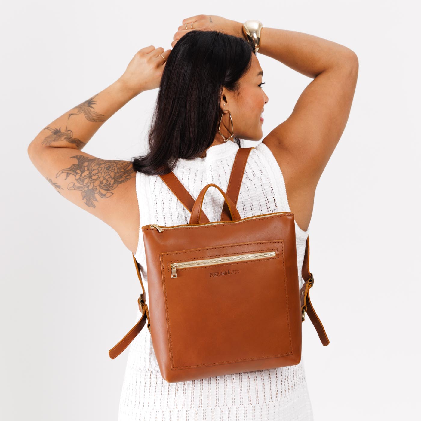 All Color: Honey | Model wearing square slim leather tote backpack