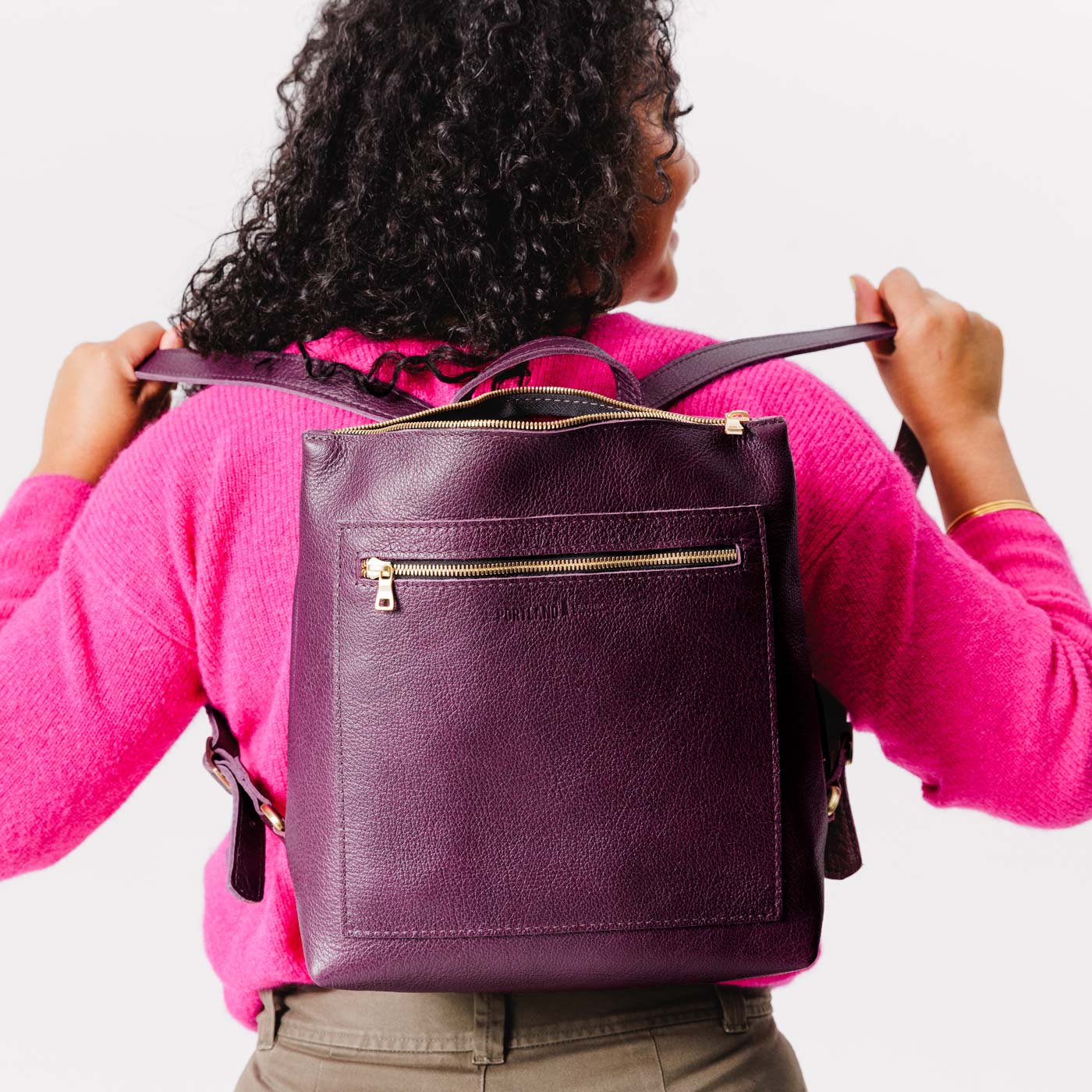 All Color: Plum | Model wearing square slim leather tote backpack