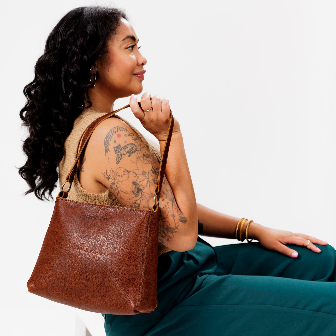  Nutmeg | Triangular shoulder bag with antiqued brass finished hardware