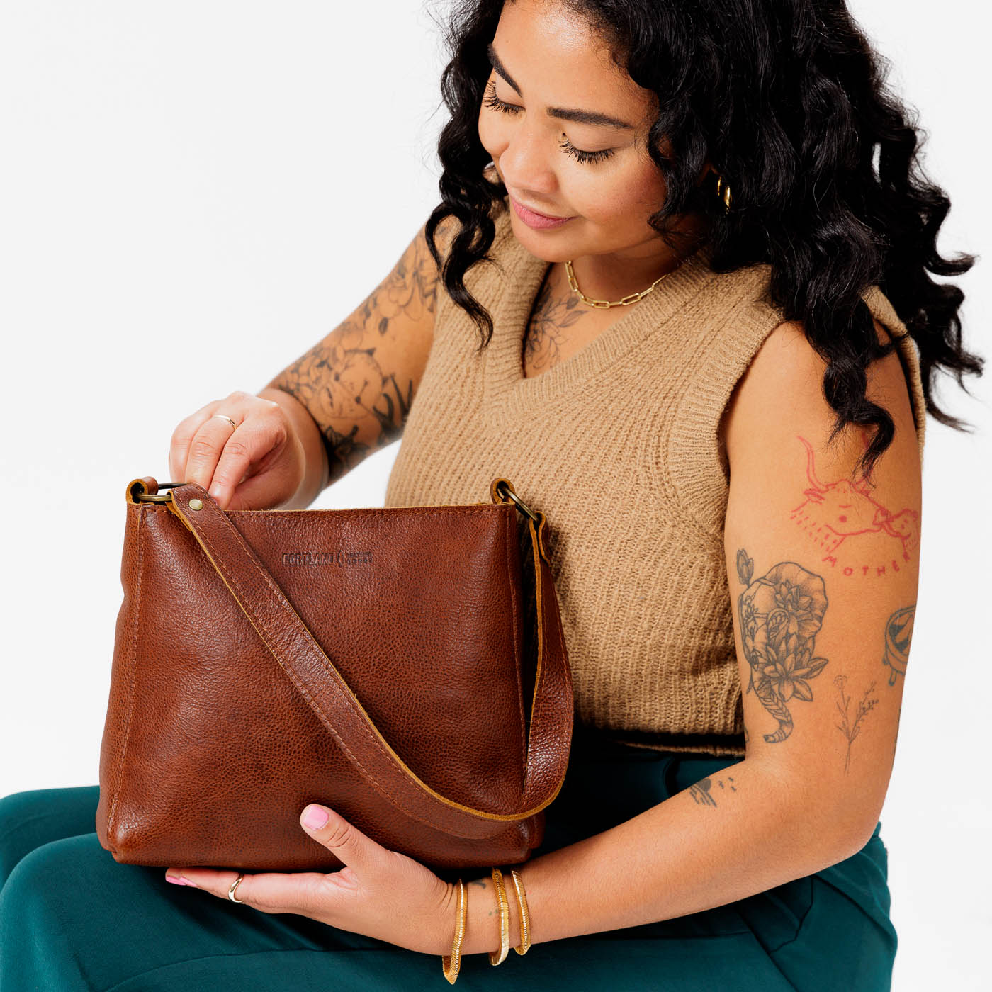  Nutmeg | Triangular shoulder bag with antiqued brass finished hardware