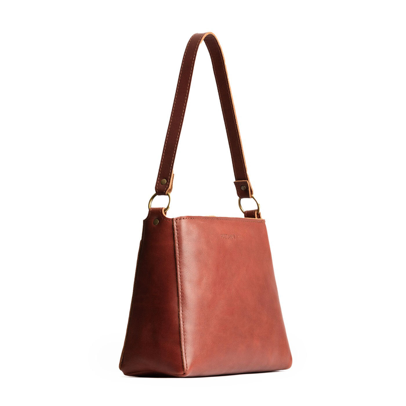 Chestnut | Triangular shoulder bag with antiqued brass finished hardware