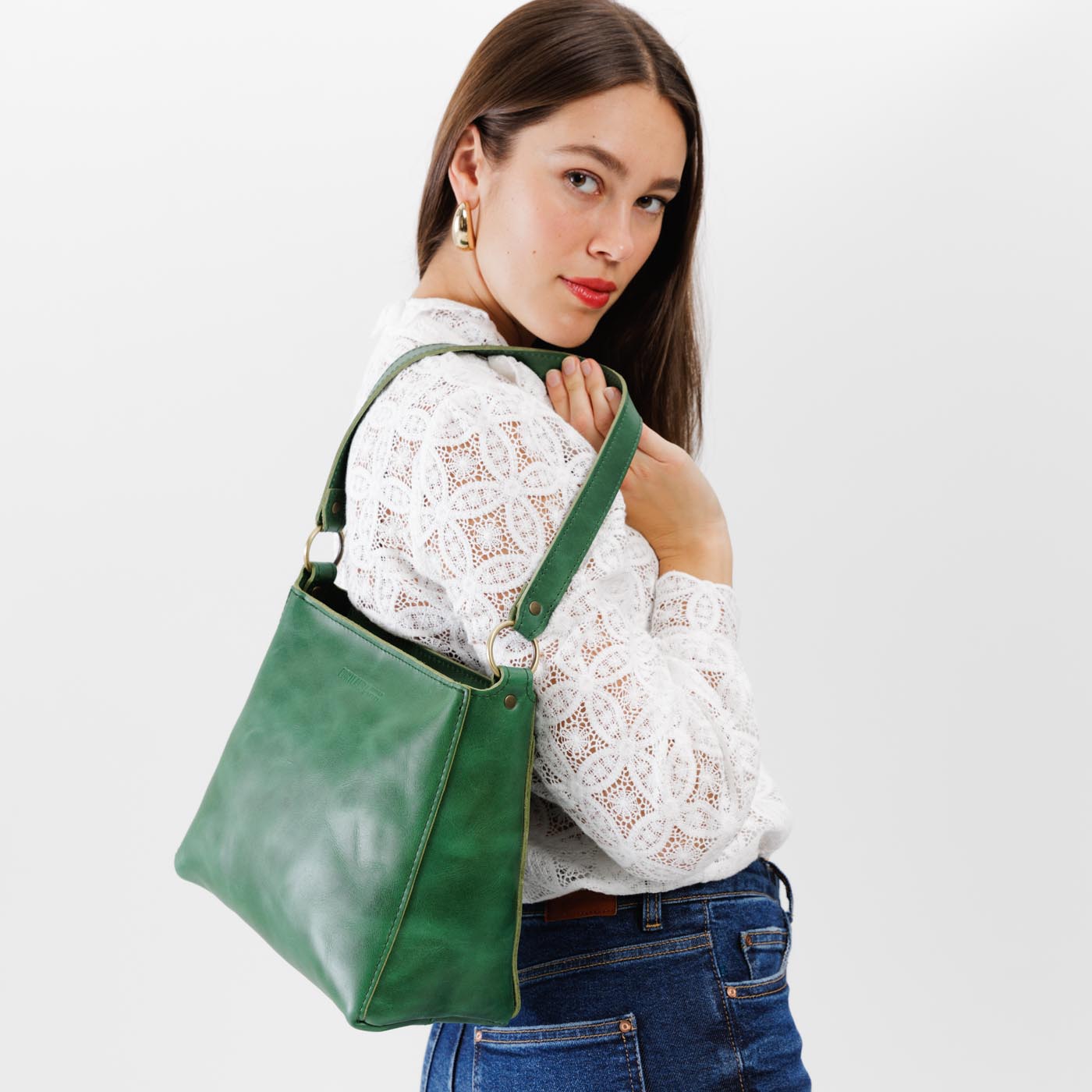  Cowboy Mint | Triangular shoulder bag with antiqued brass finished hardware